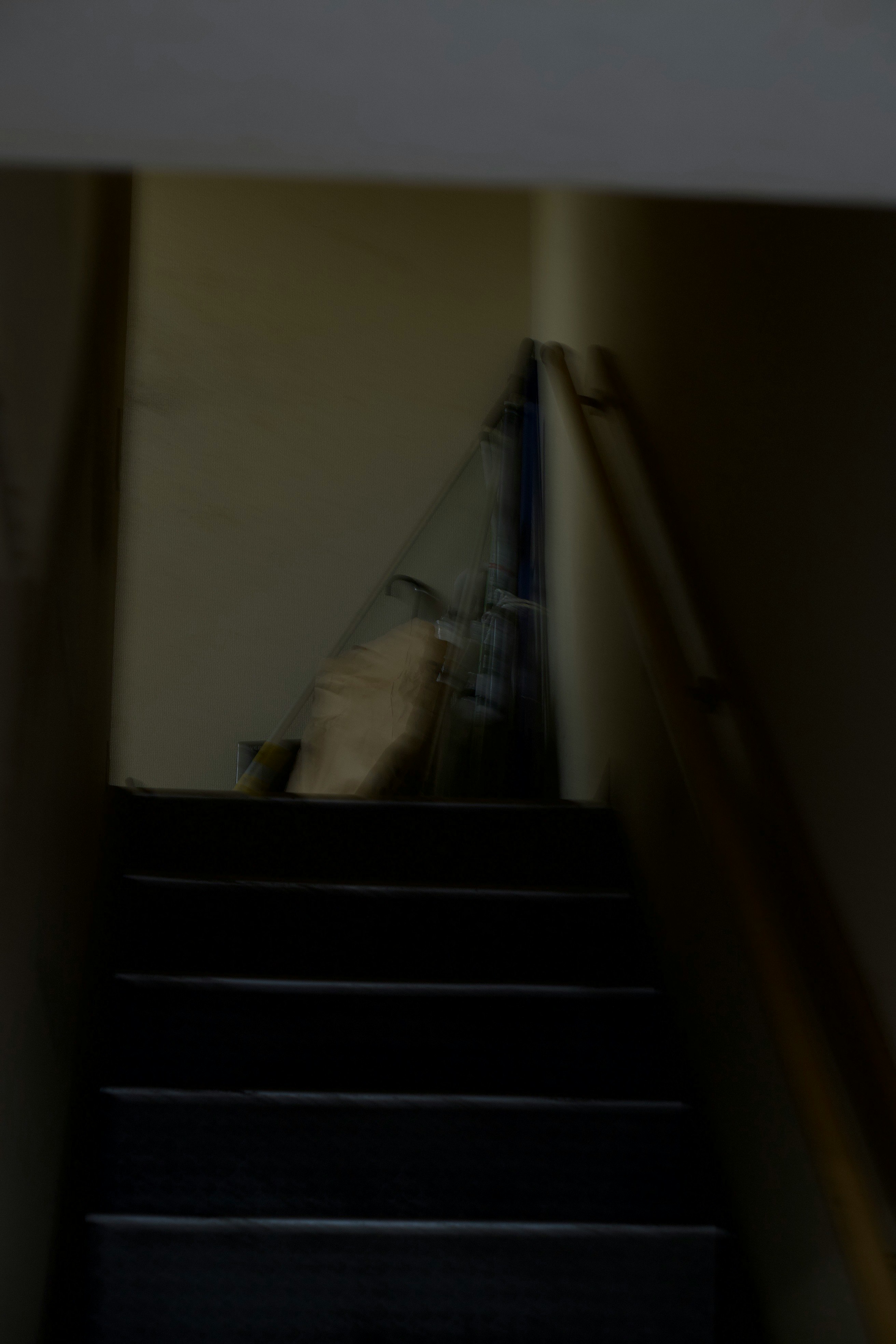 indoor stairwell with objects leaning against the wall