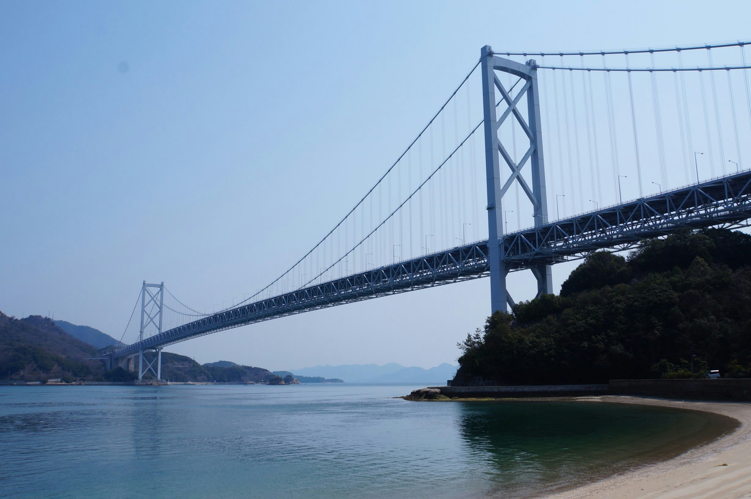 suspension bridge over the sea with calm water view