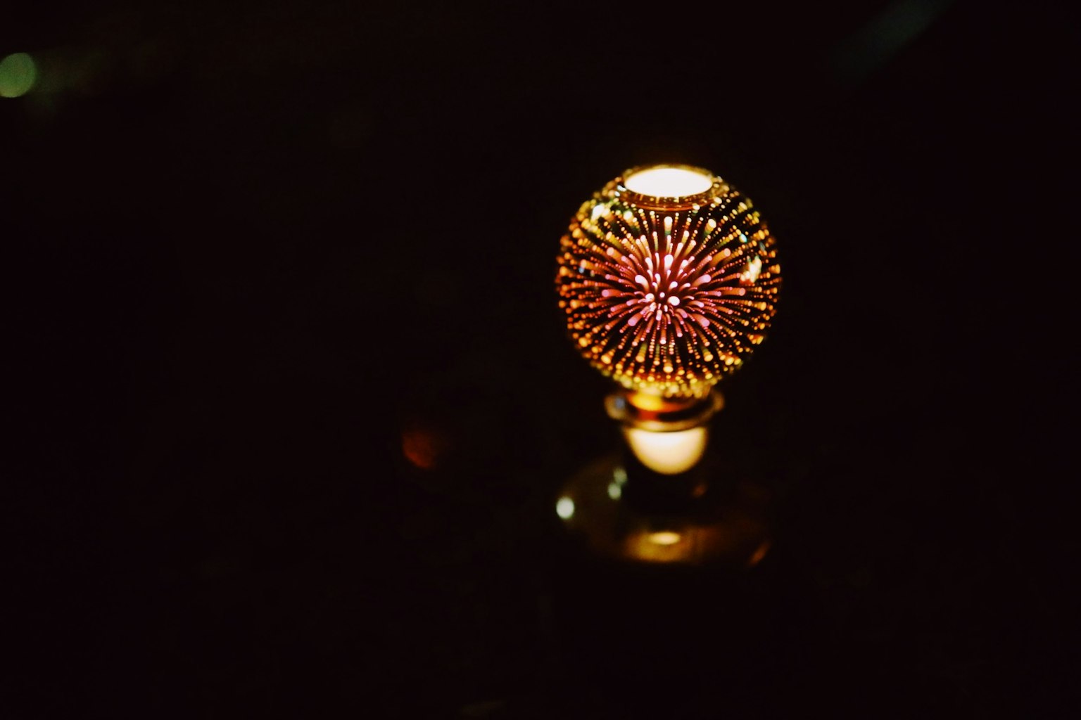Decorative lamp sphere glowing against a dark background