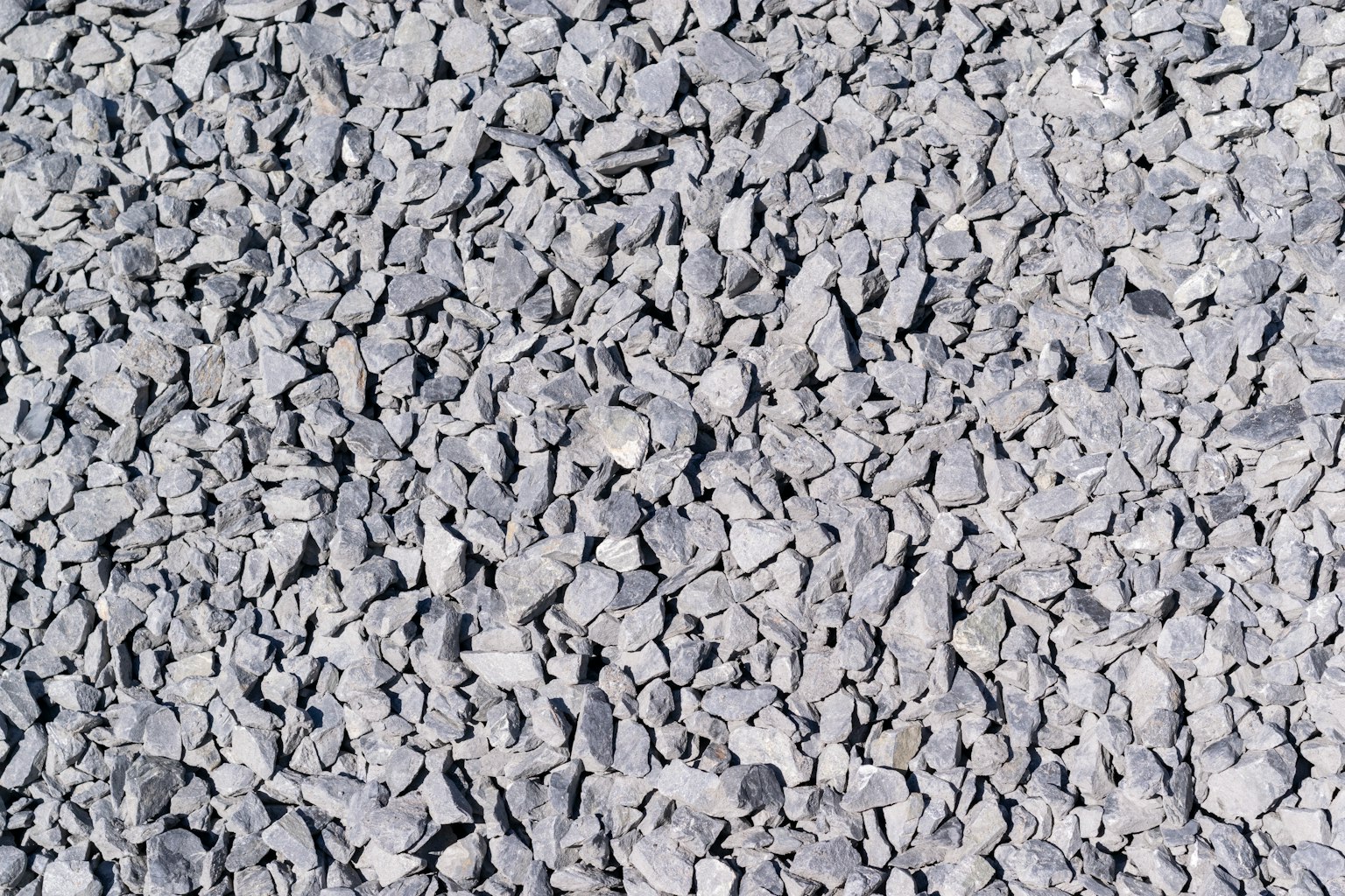 Surface of gray crushed stone