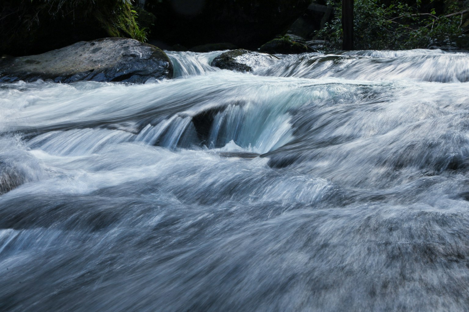 Beautiful scene of flowing water Small stream in the forest Water appears like a waterfall