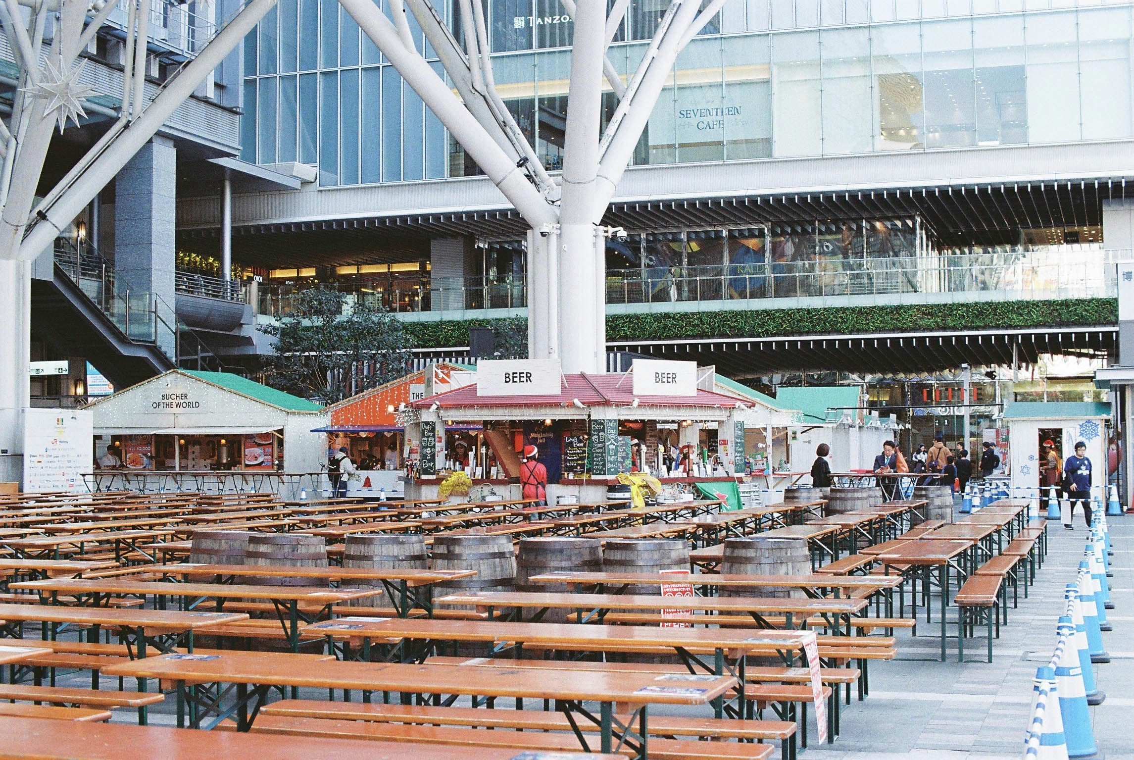 indoor market hall with rows of stalls and benches