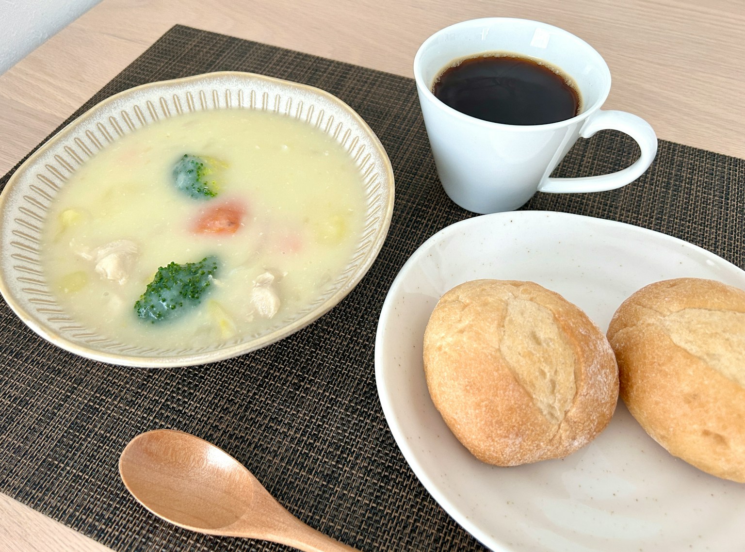 Breakfast table with warm soup and bread