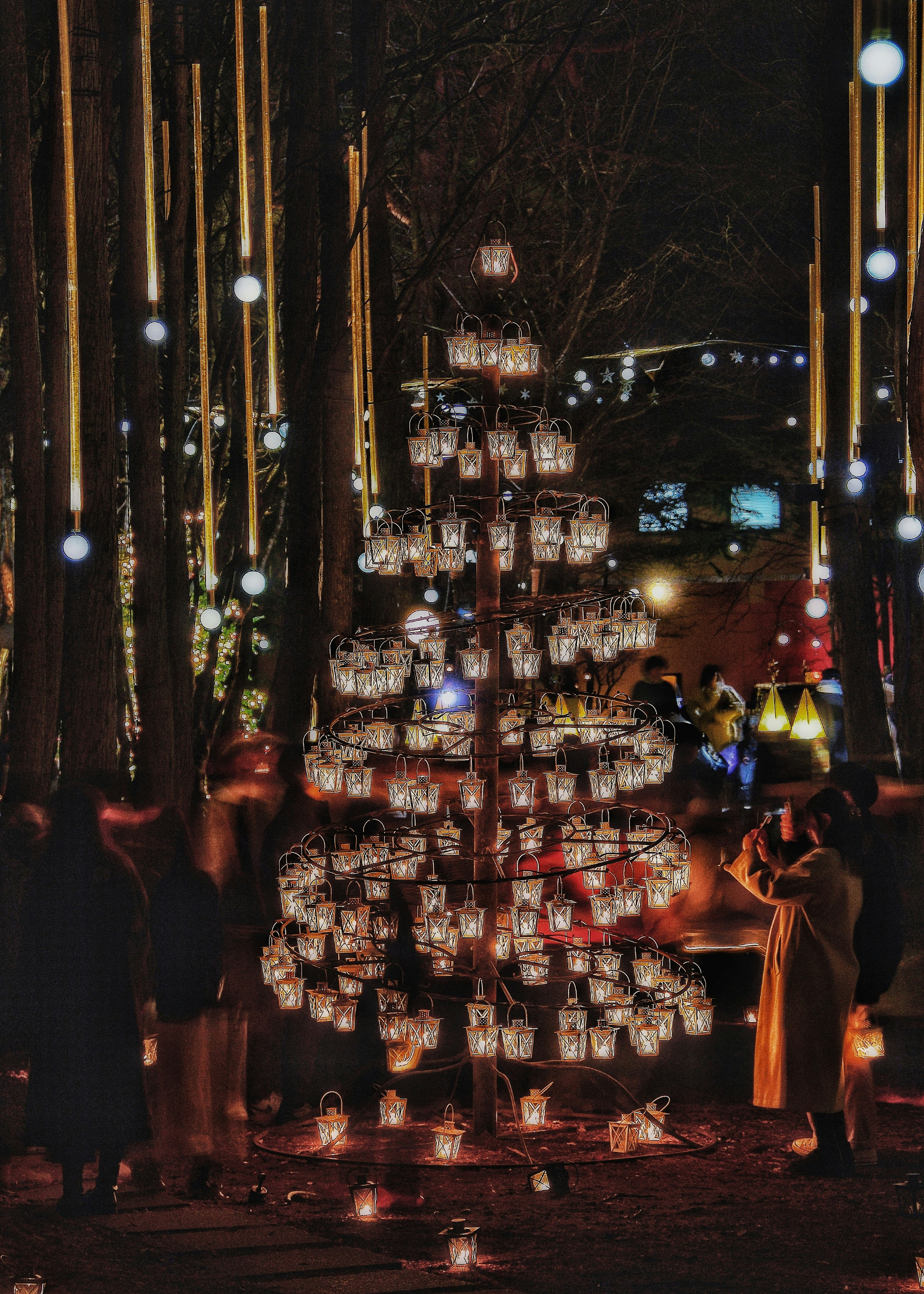 Christmas candle display in the forest under a starry sky at Karuizawa Kogen Church