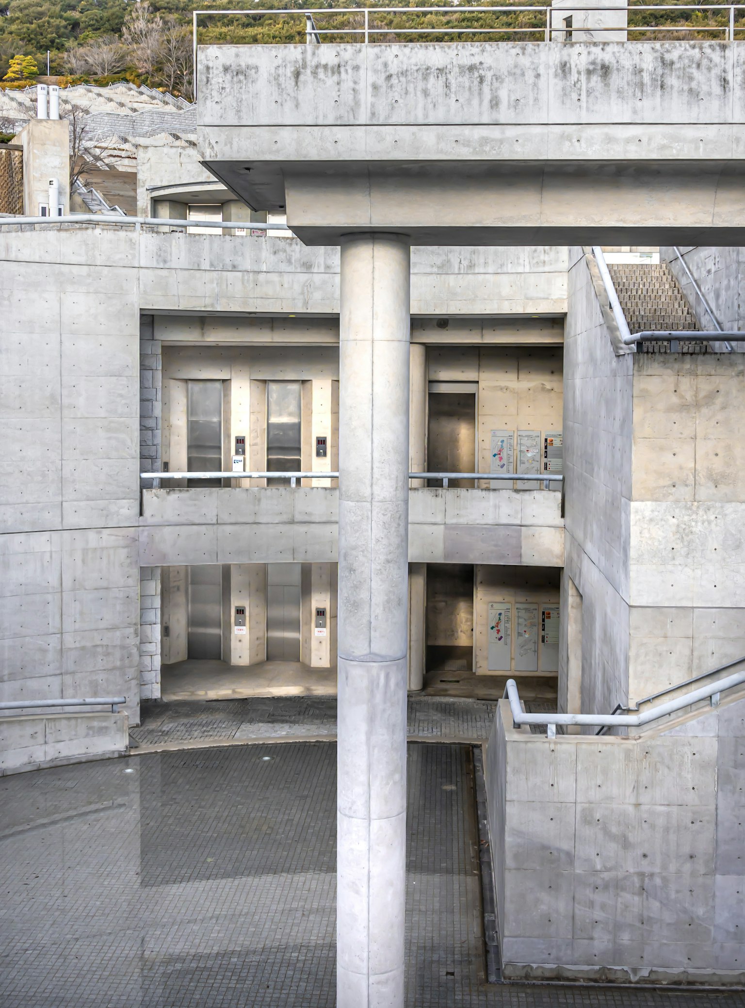 Interior view of a concrete structure showcasing architectural elements and stair design