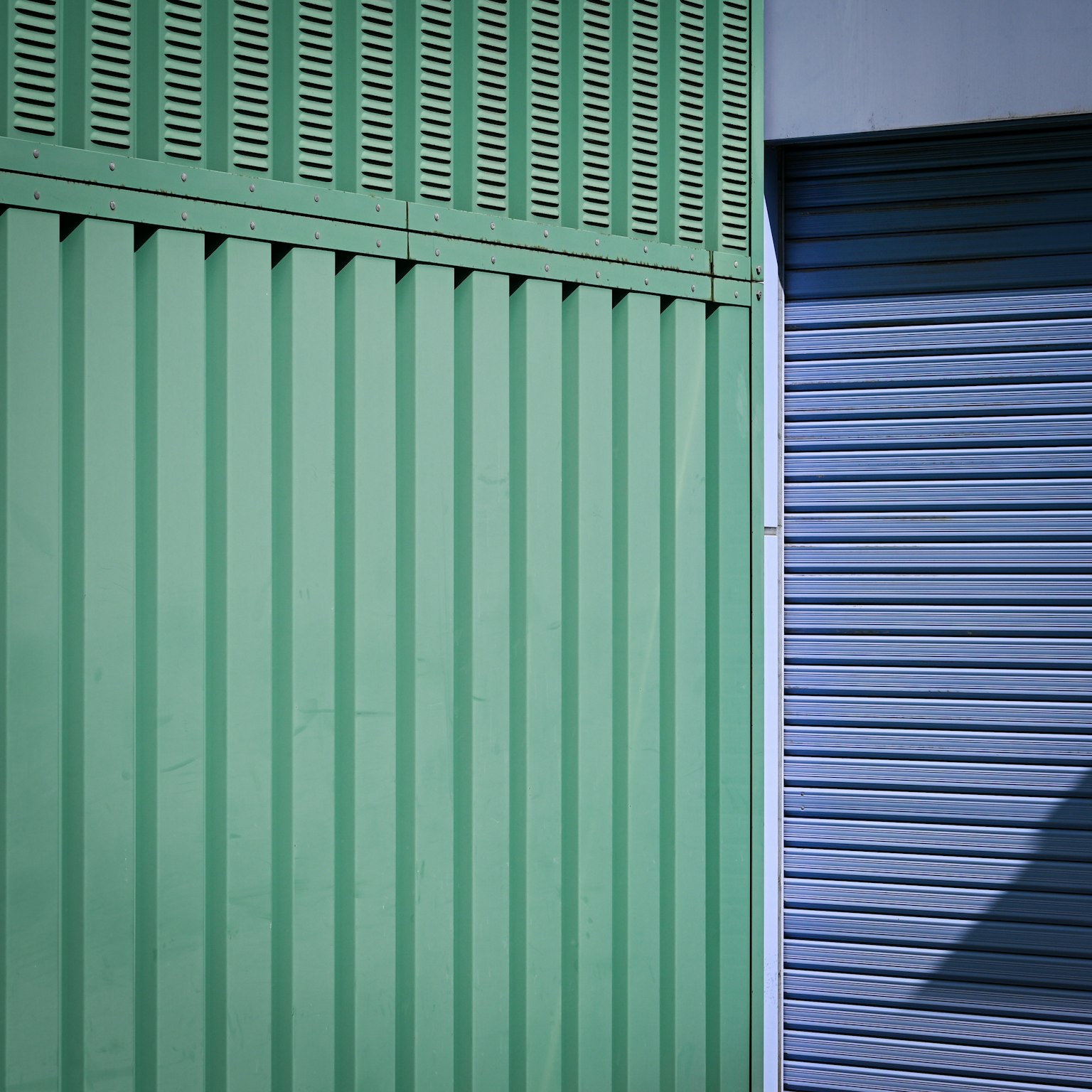 Close-up of green and blue striped walls