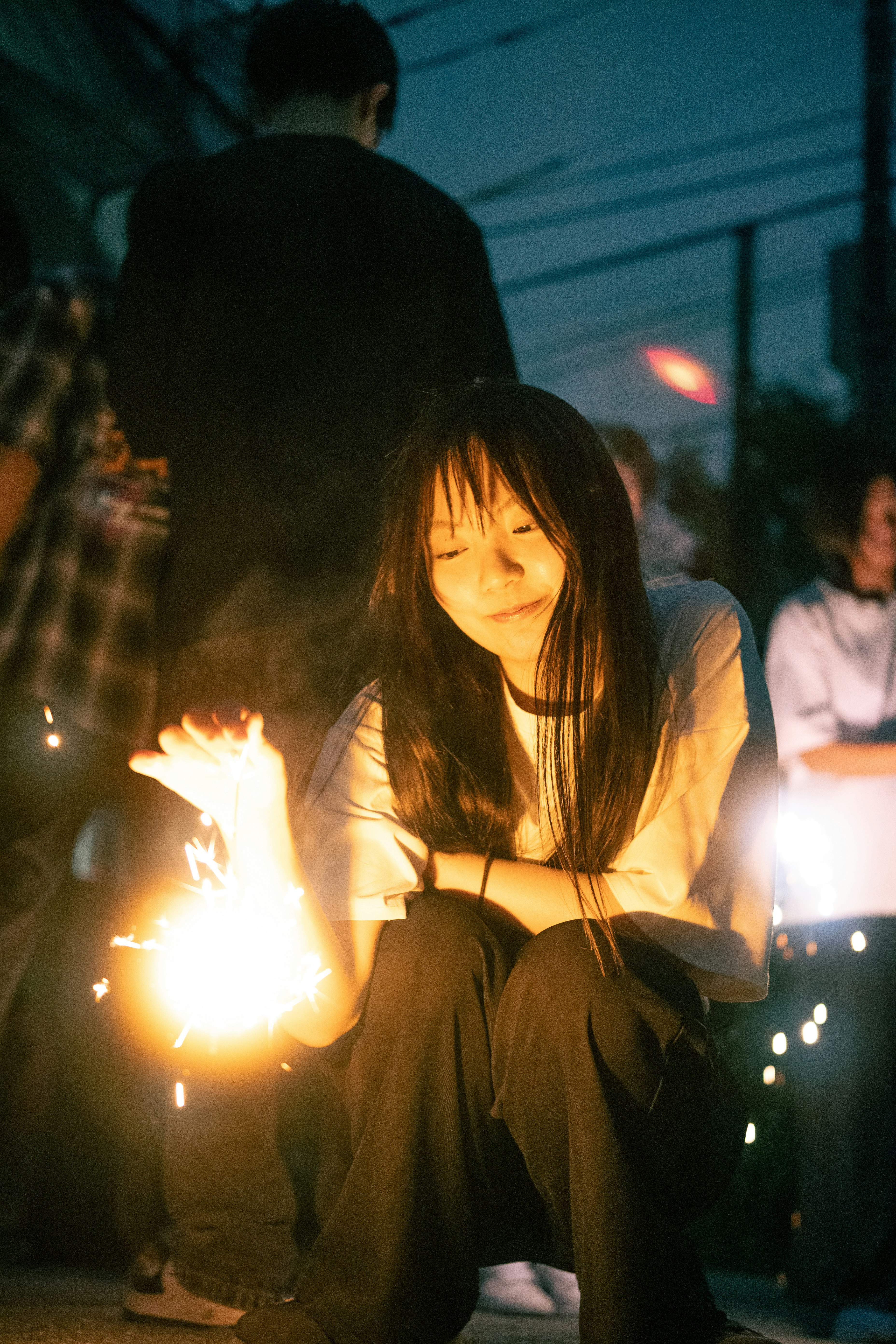 child in a yukata holding sparklers