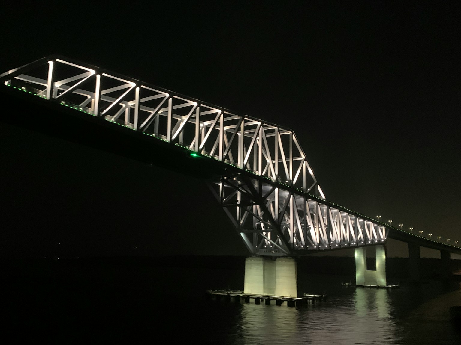 Illuminated bridge structure at night