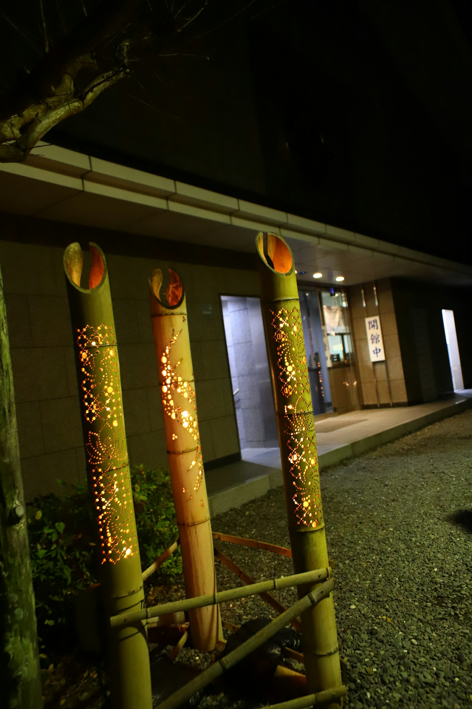 Illuminated bamboo lanterns at night