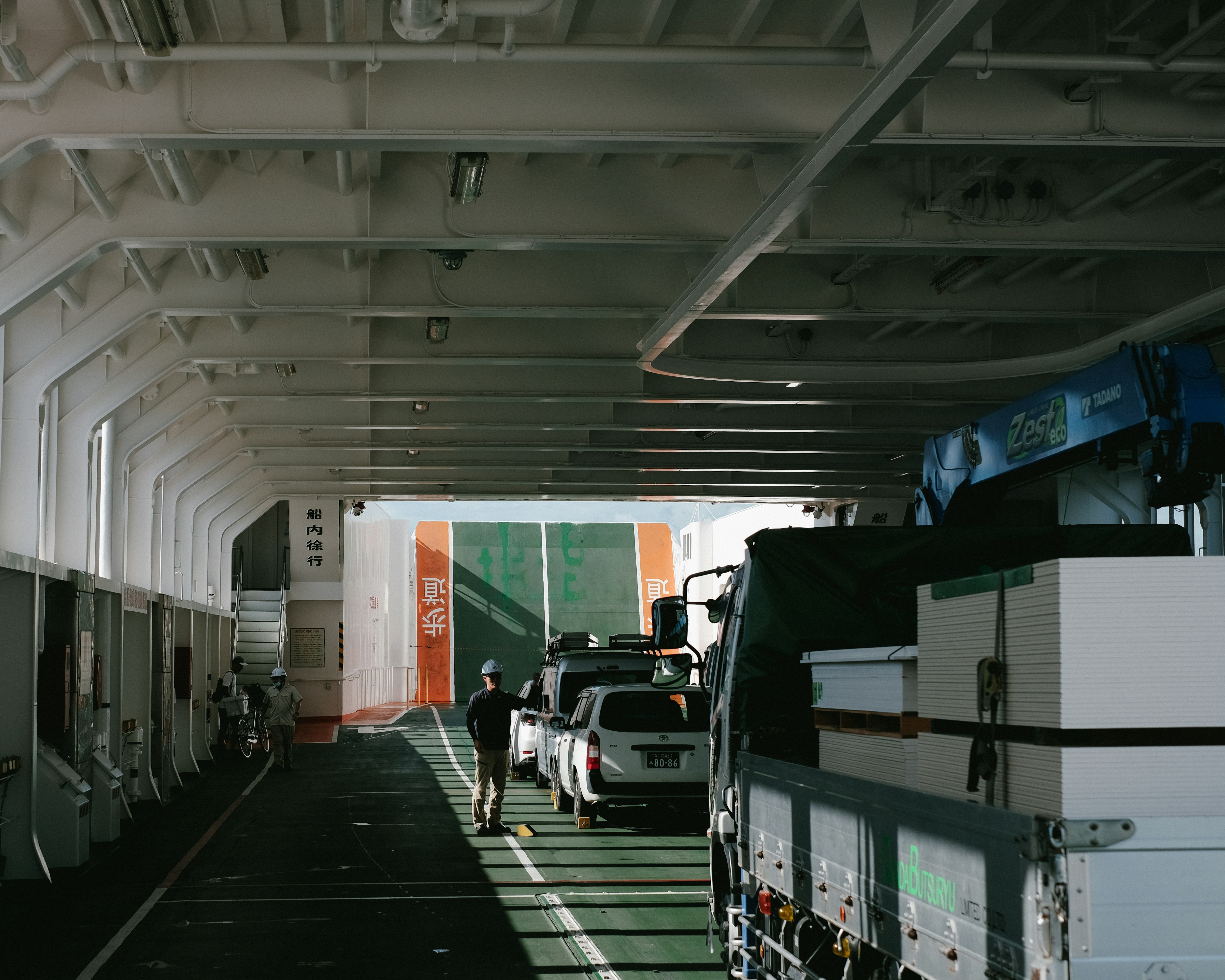 underground corridor with parked vehicles