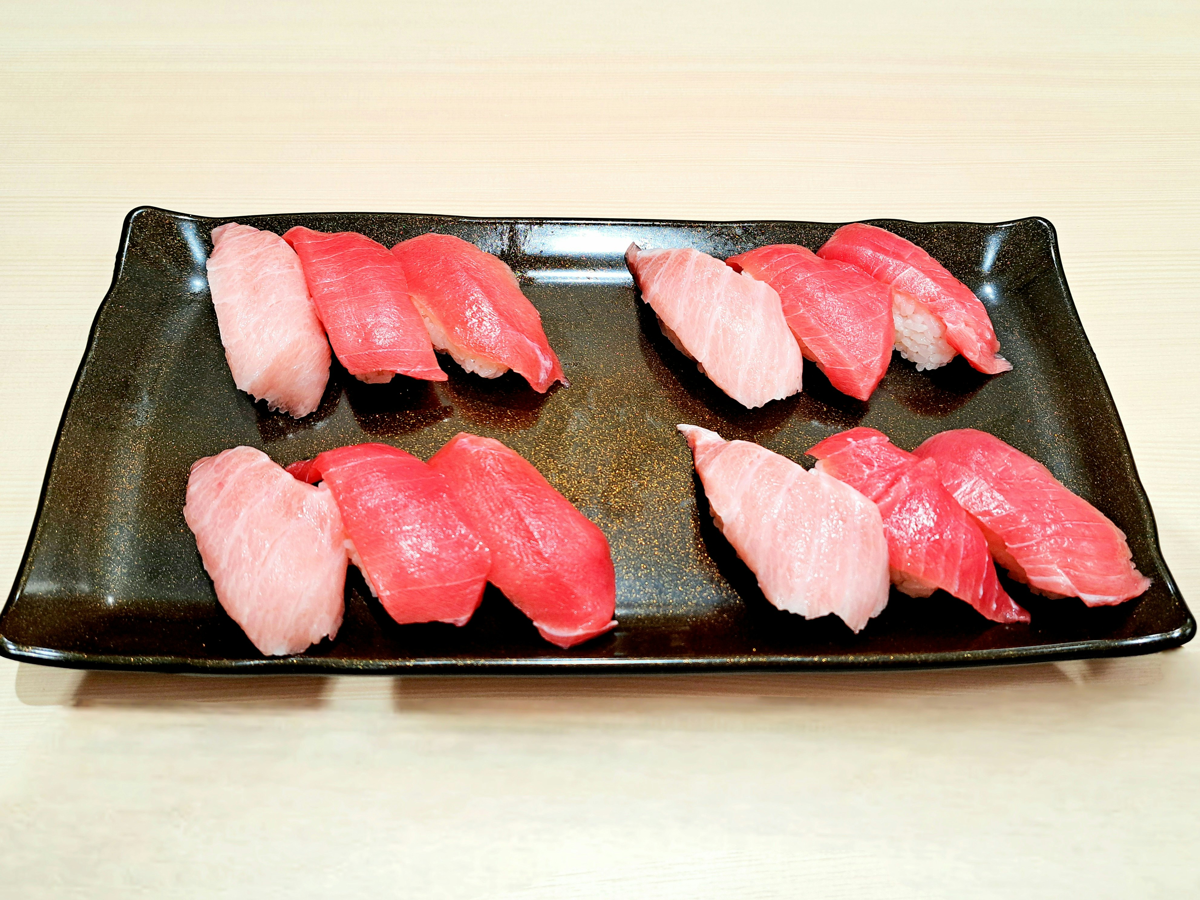 sliced tuna sashimi arranged on a plate