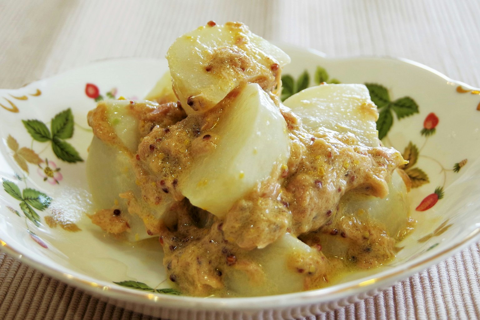 A bowl of potato salad with creamy dressing