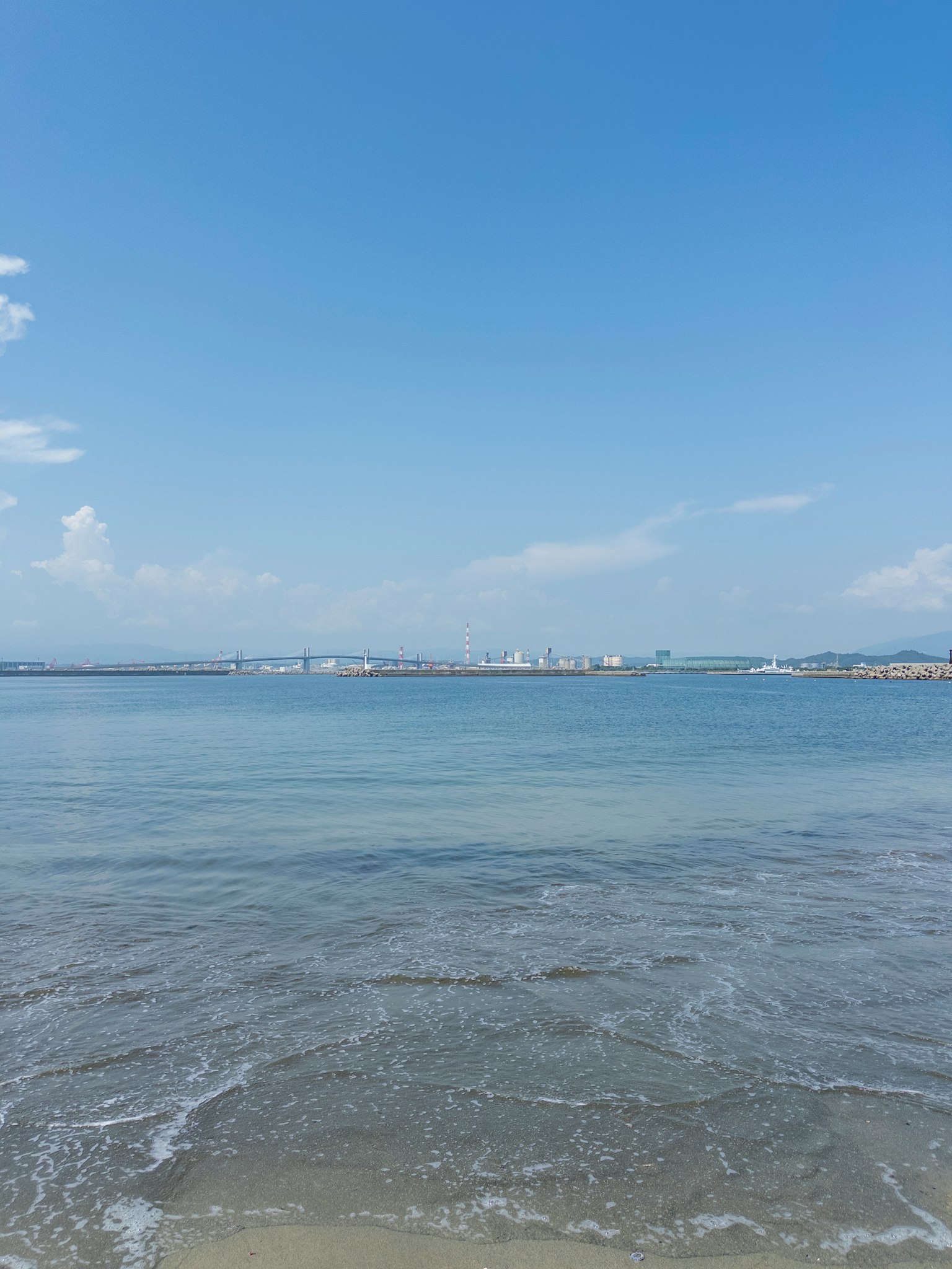 Scenic view of blue ocean and sky with calm waves at the beach