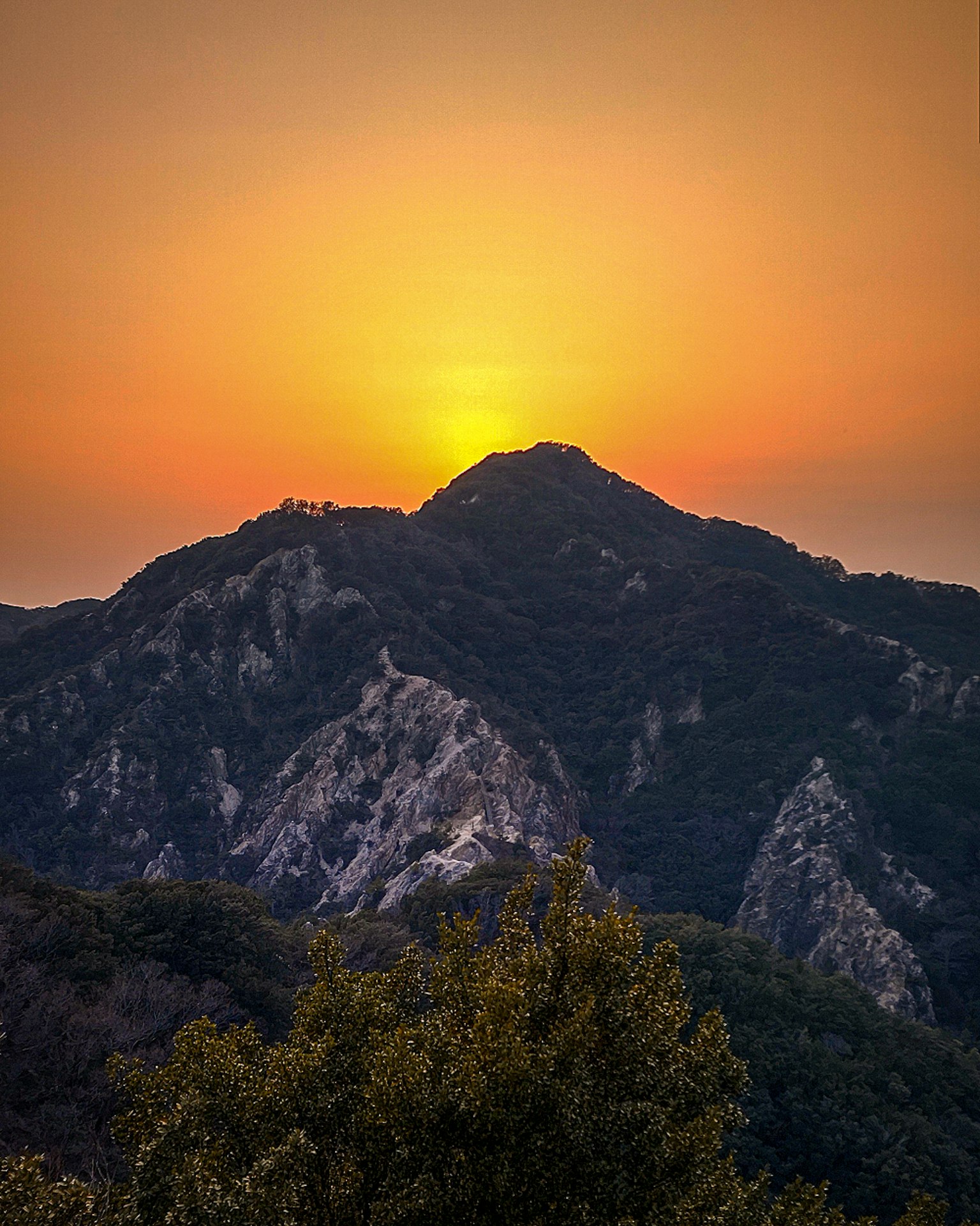 Silhouette of mountains with a beautiful sunset in the background