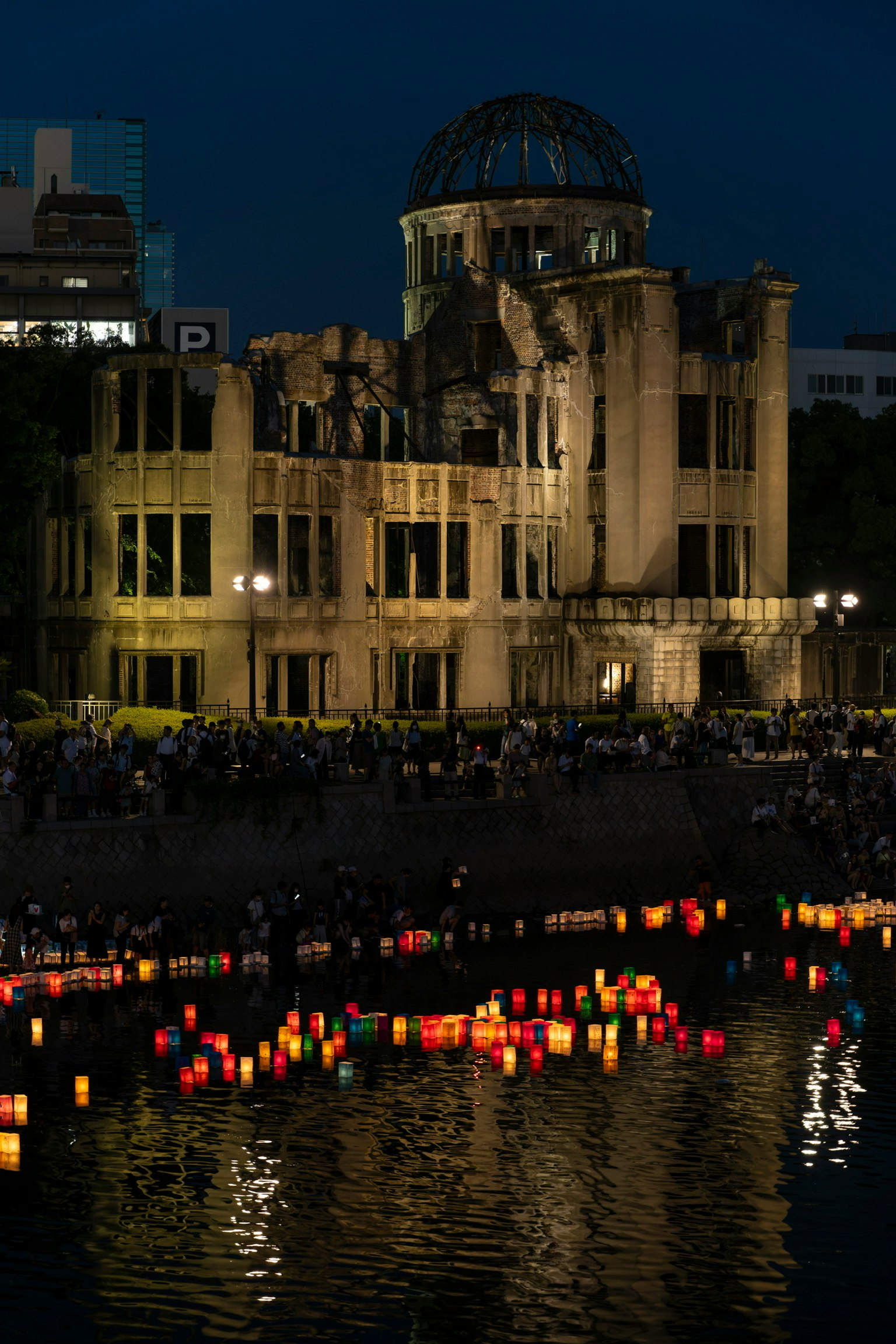 Night view of Hiroshima Peace Memorial Park with lanterns floating on the river and the Atomic Bomb Dome
