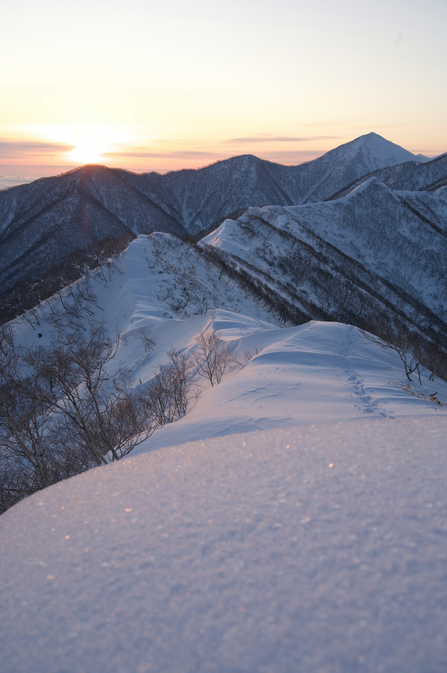 Beautiful view of snow-covered mountains and sunset