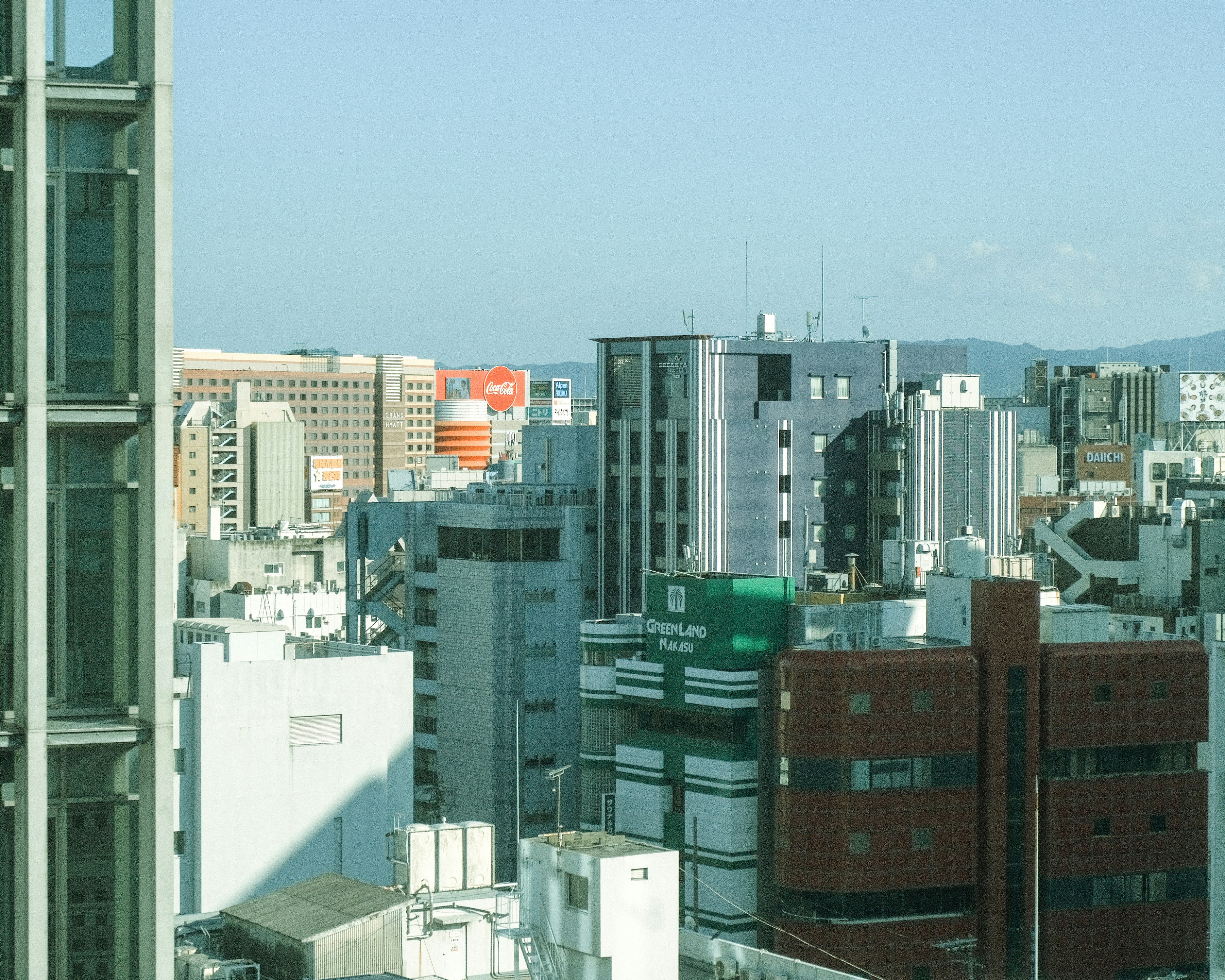 city skyline view with distant mountains