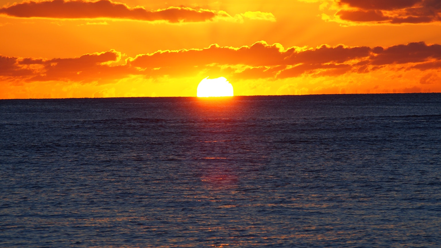 A beautiful sunset over the ocean horizon