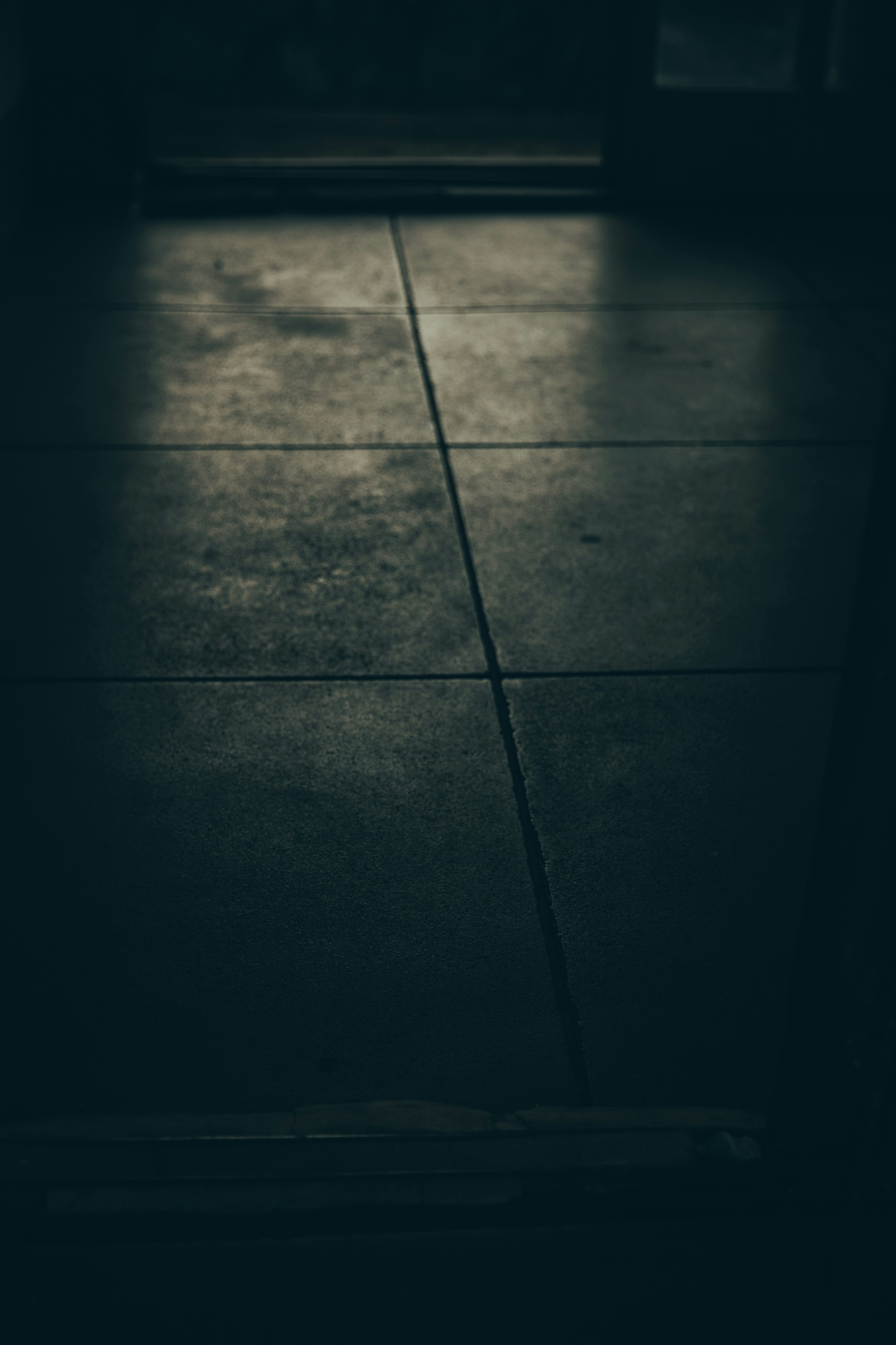 dark indoor floor tiles with shadows