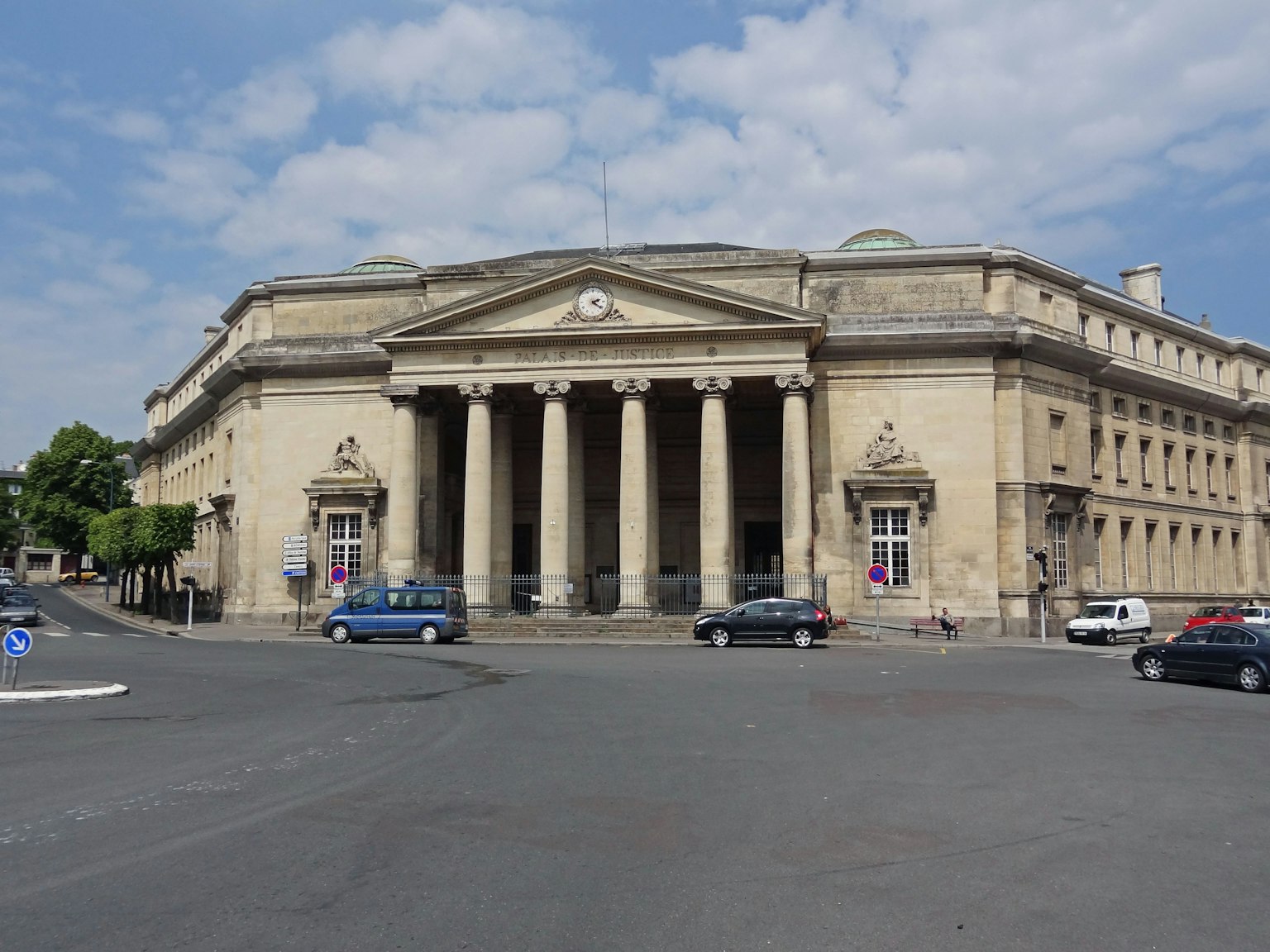 Historic building with large columns and blue sky