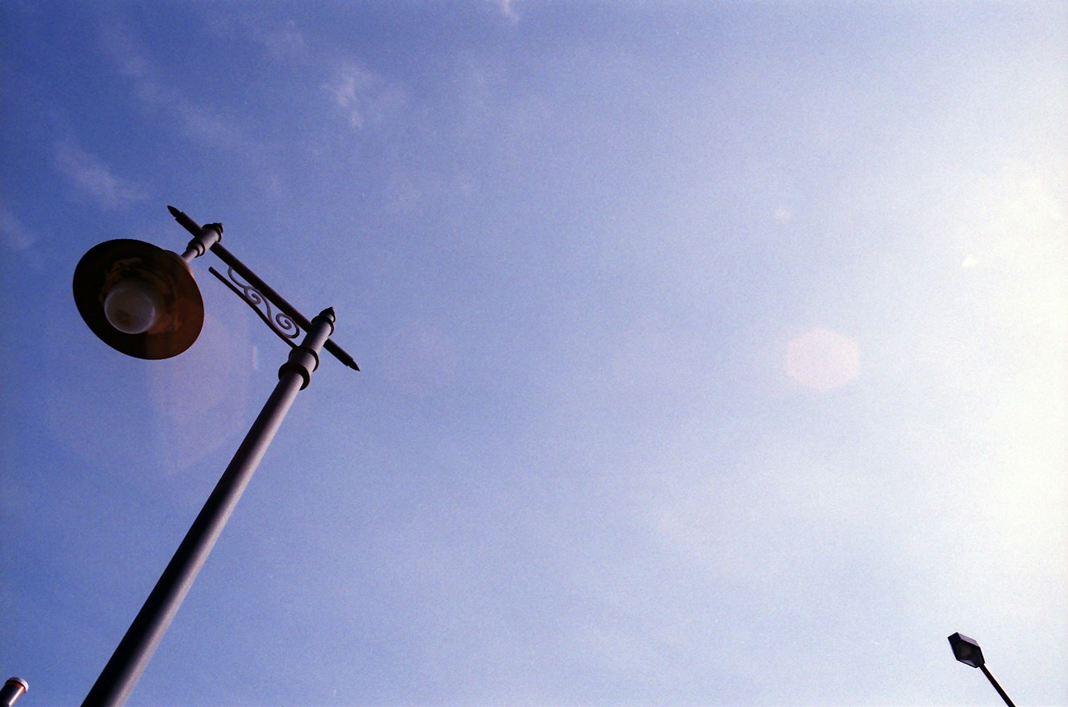 Street lamp under a blue sky