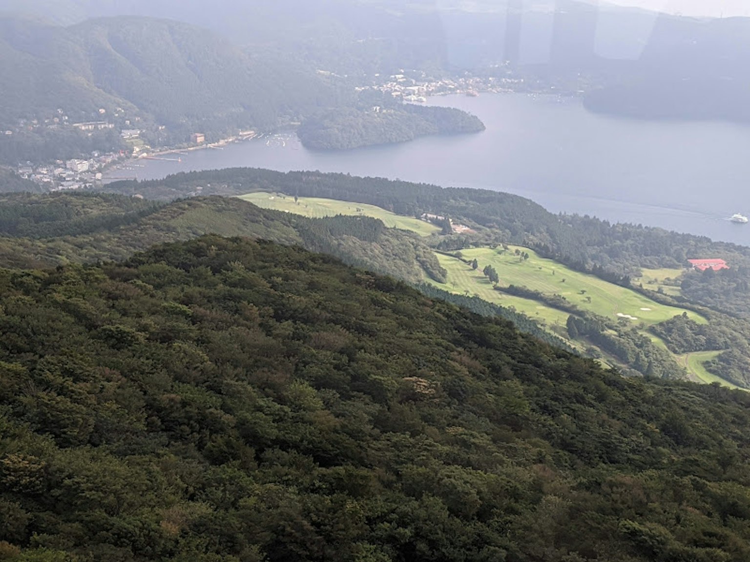 Lush green mountain landscape with a beautiful view of the lake