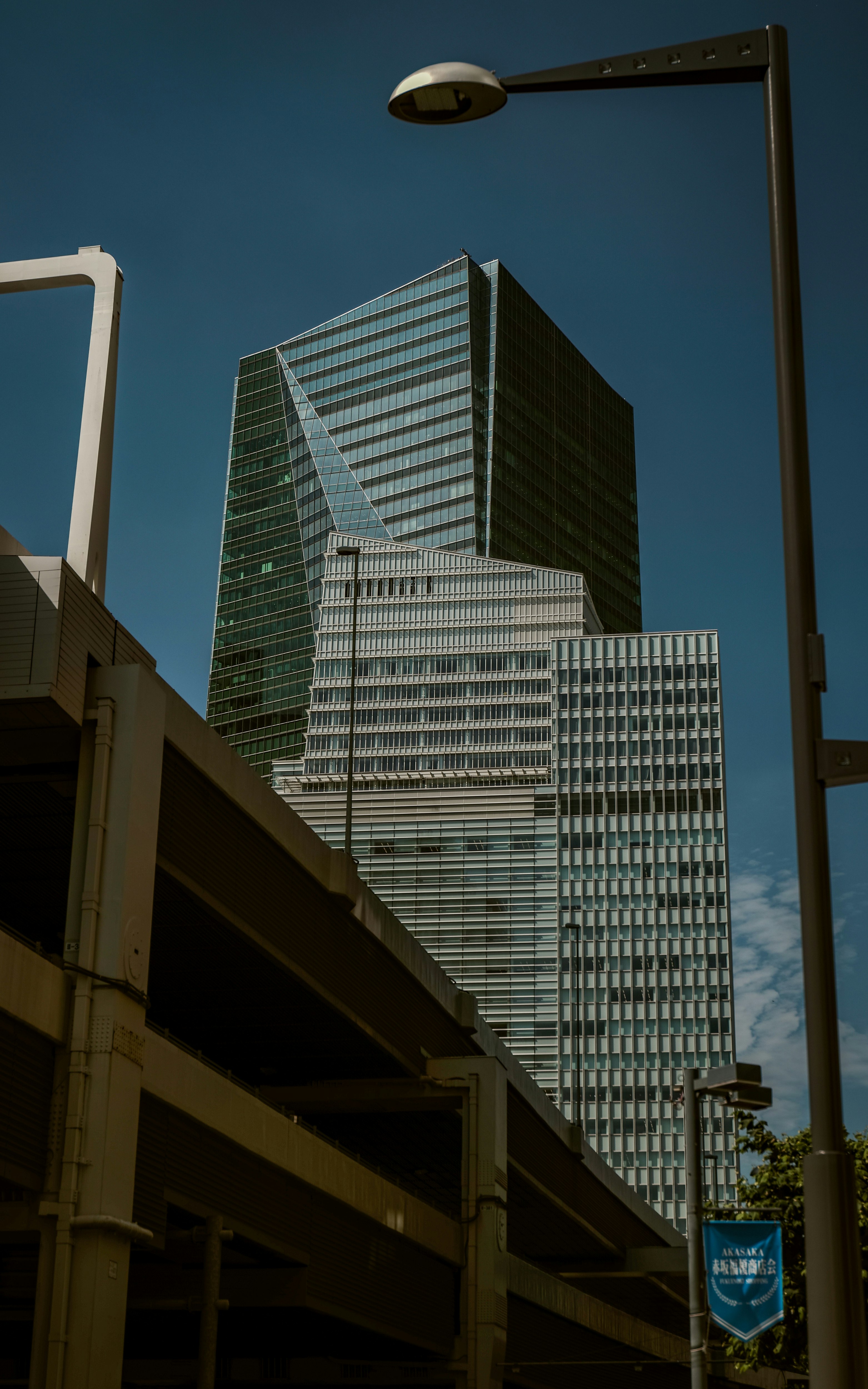 city street scene with streetlights and tall office buildings