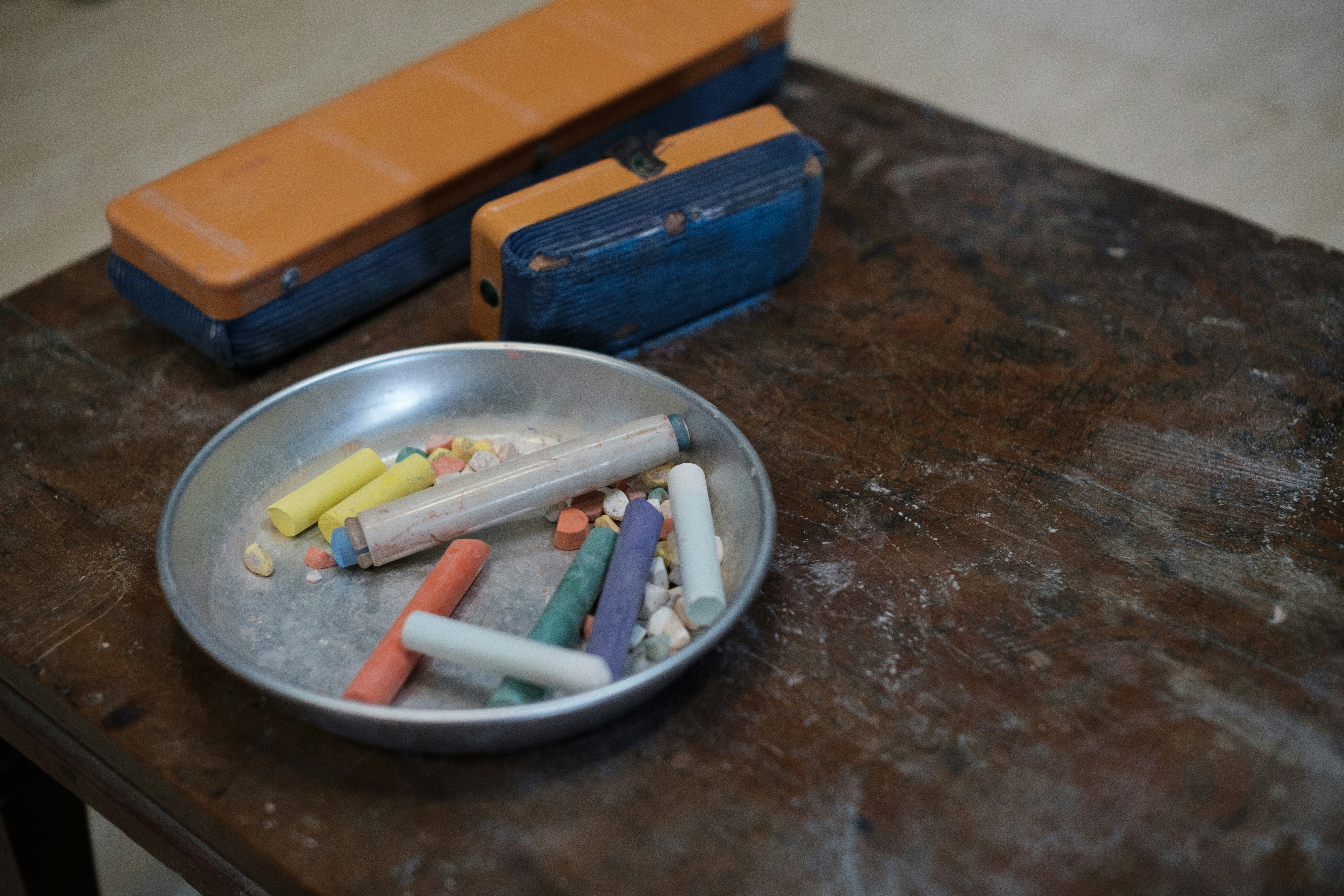 Colorful chalk and eraser on a table