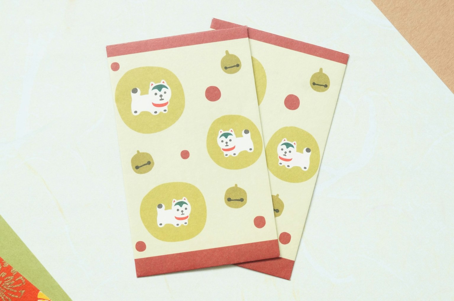 Two Japanese-style envelopes featuring illustrations of dogs