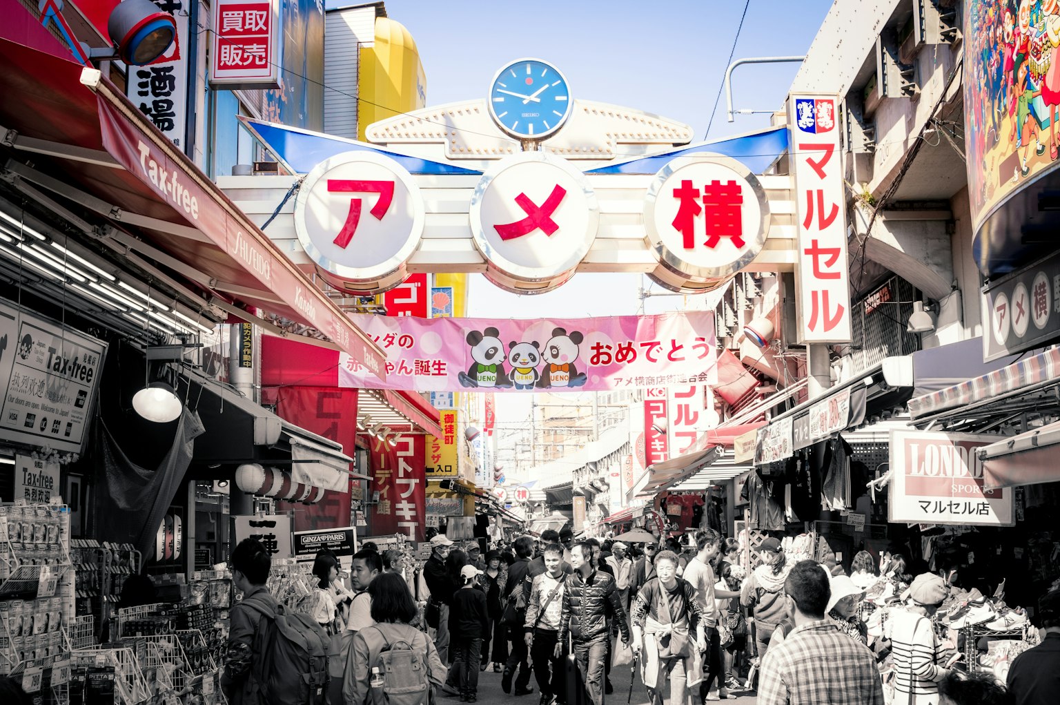 Bustling market scene at Ameyoko with many people and shops