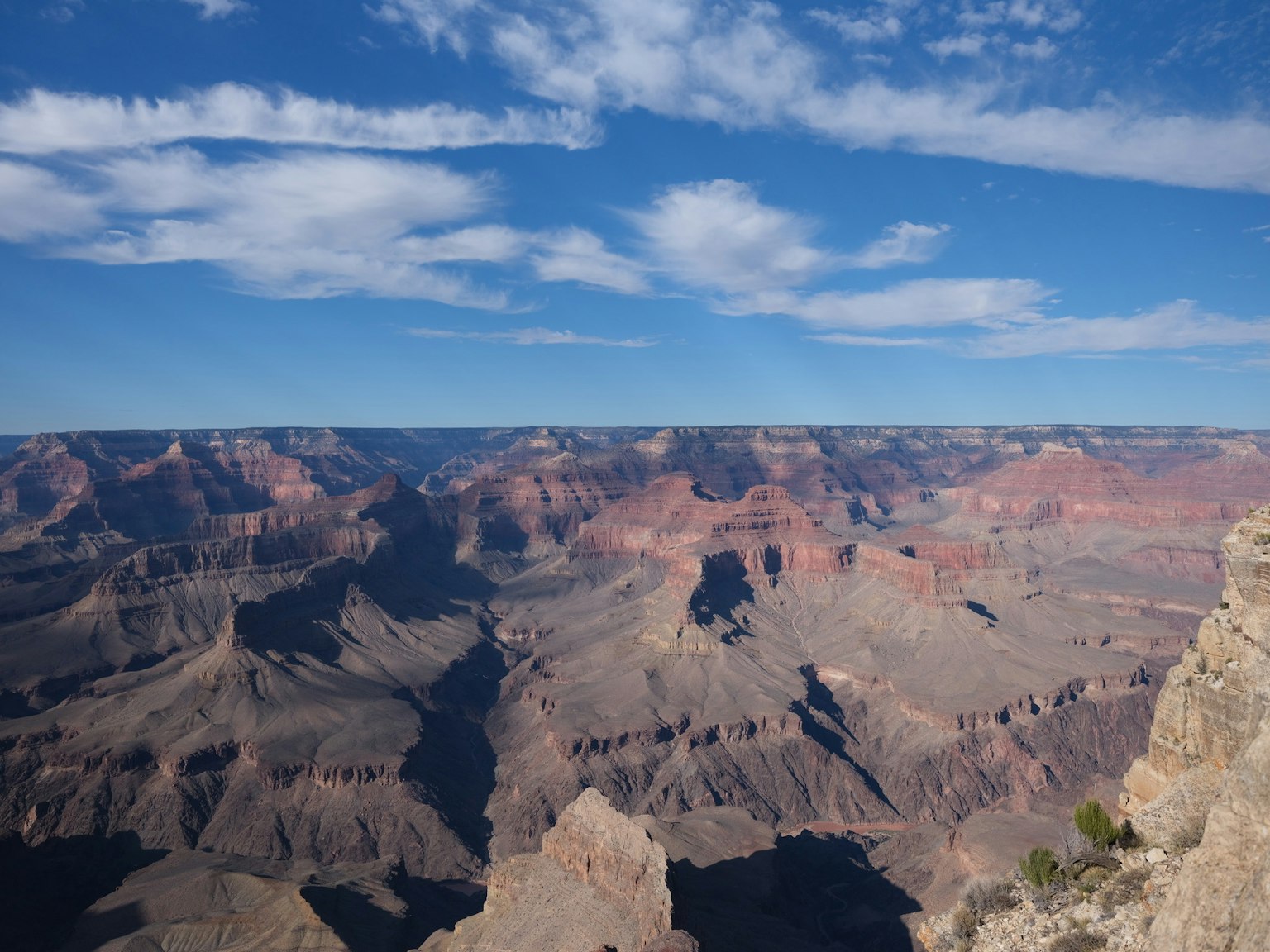 Grand Canyon landscape with blue sky and clouds