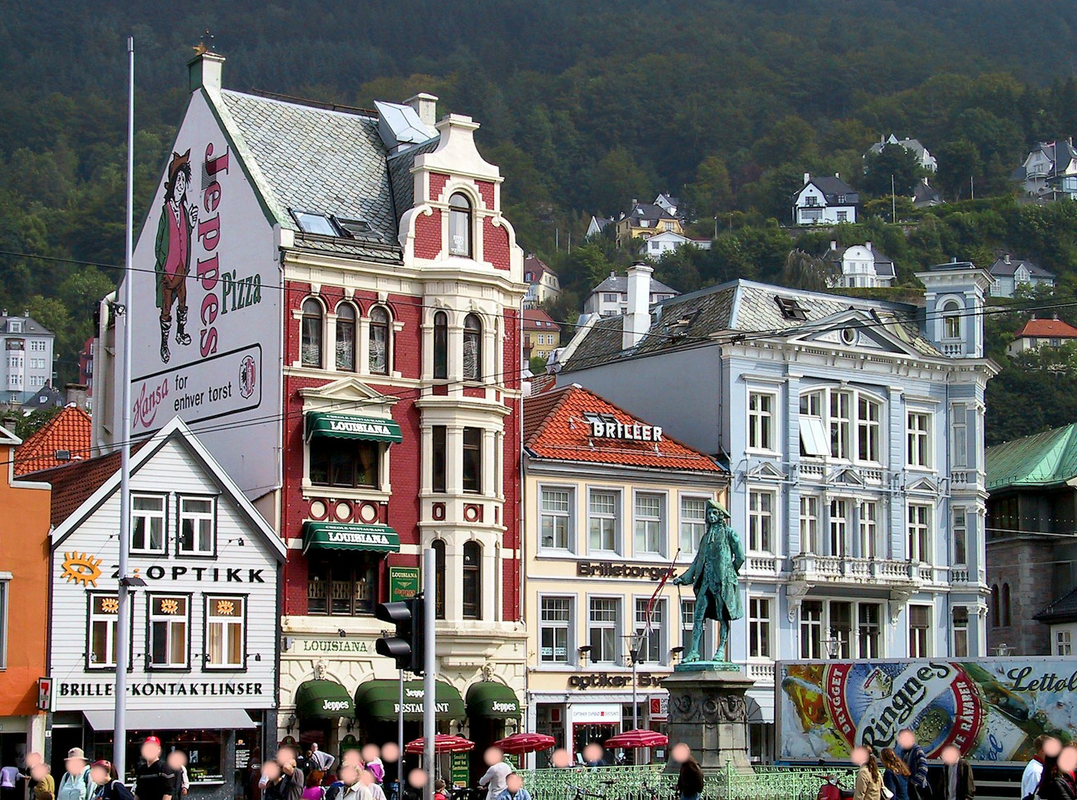Colorful buildings lined up with people gathered in the foreground