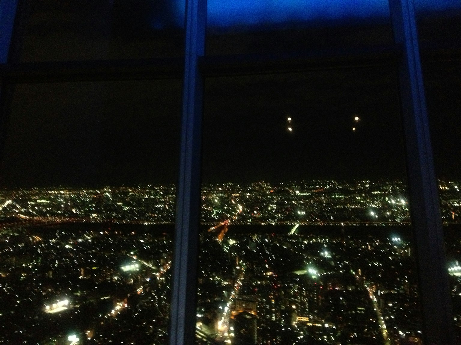 Panoramic view of city skyline at night with sparkling lights