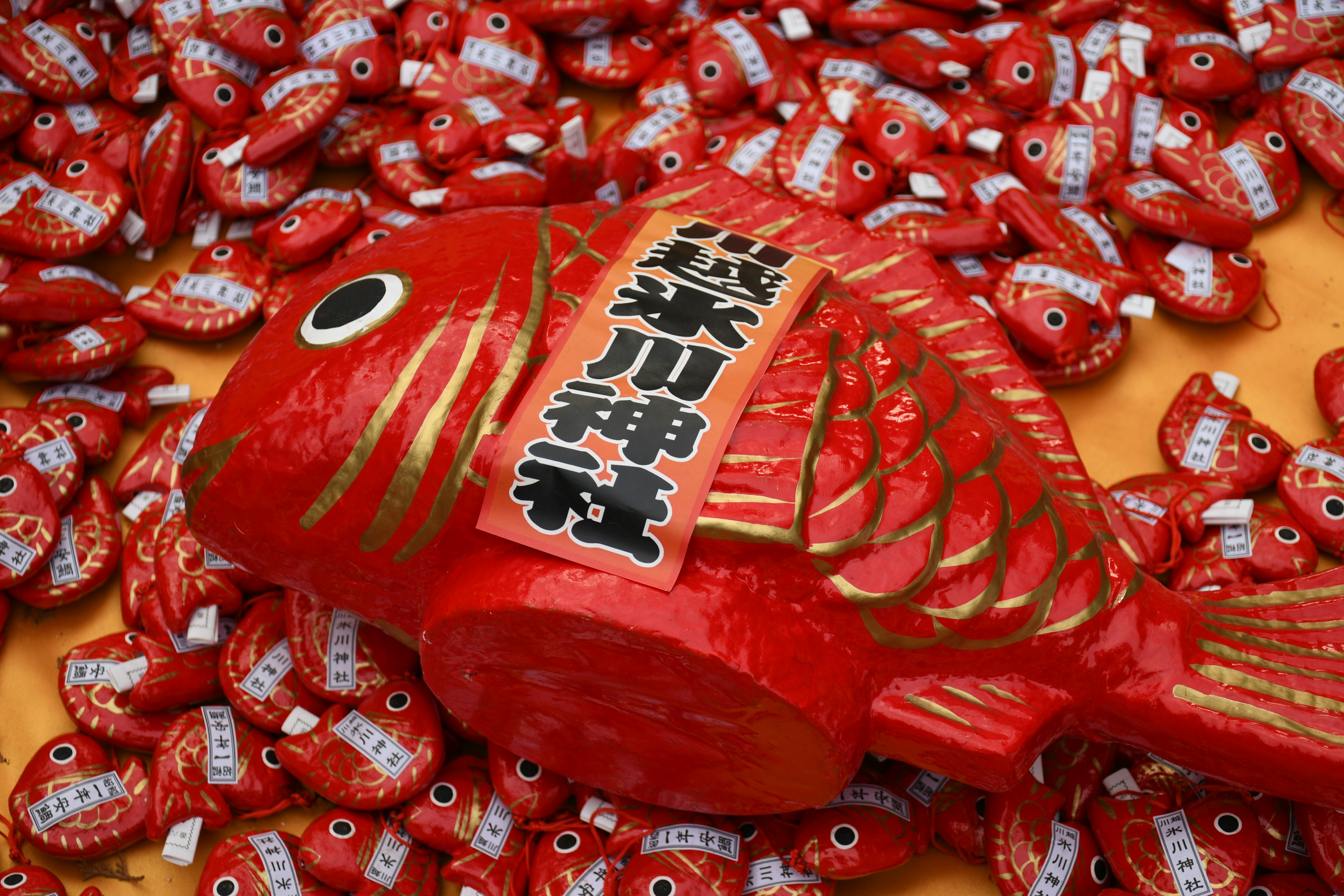 red lucky ornament with a pile of small candies