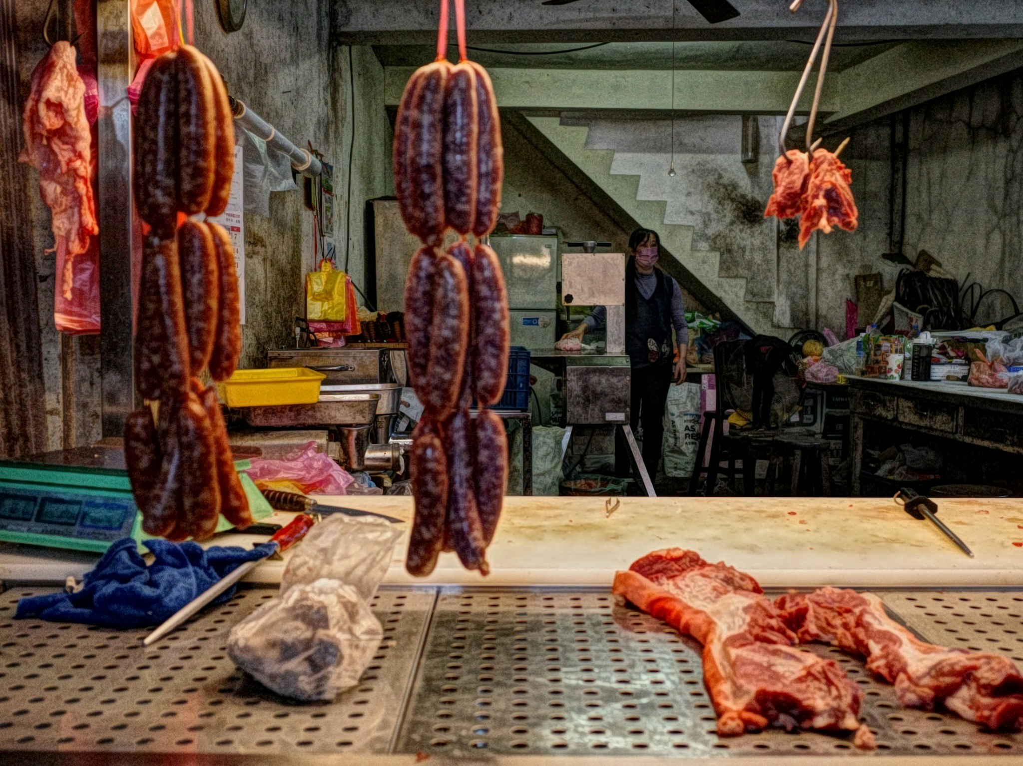 Taiwan butcher shop alley with hanging cured meats and storefront display