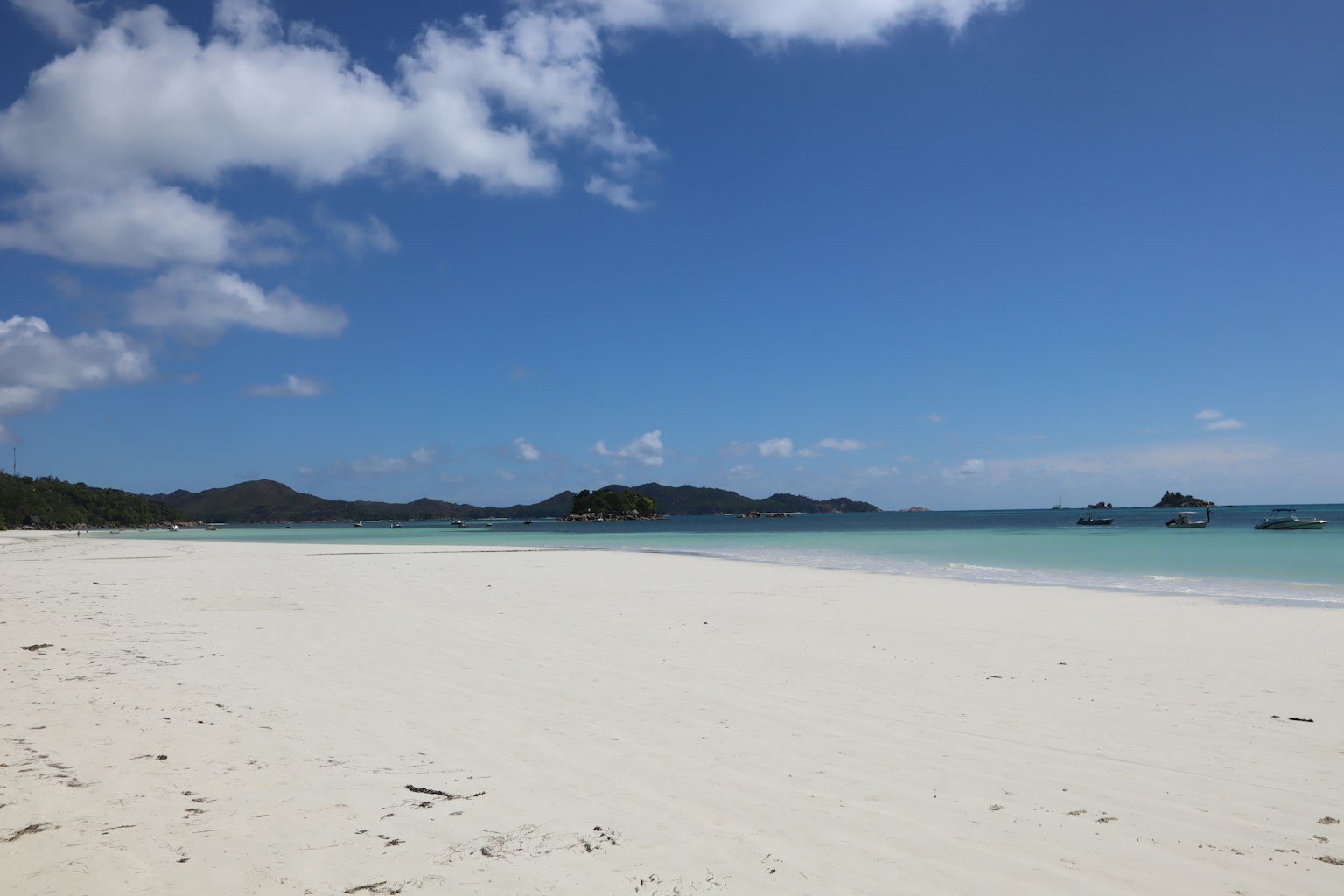 Beautiful beach landscape with blue sky and white sandy shore