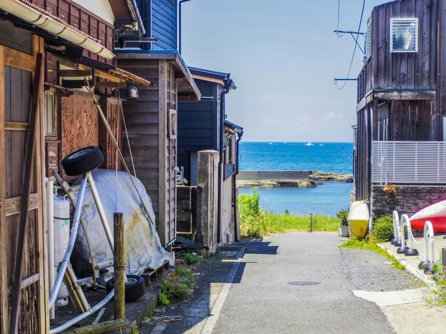 Scenic pathway with a view of the sea surrounded by old houses