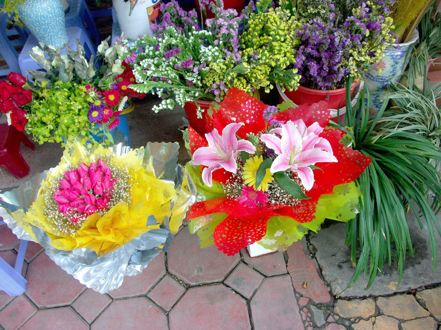 Colorful flower bouquets displayed in a market setting