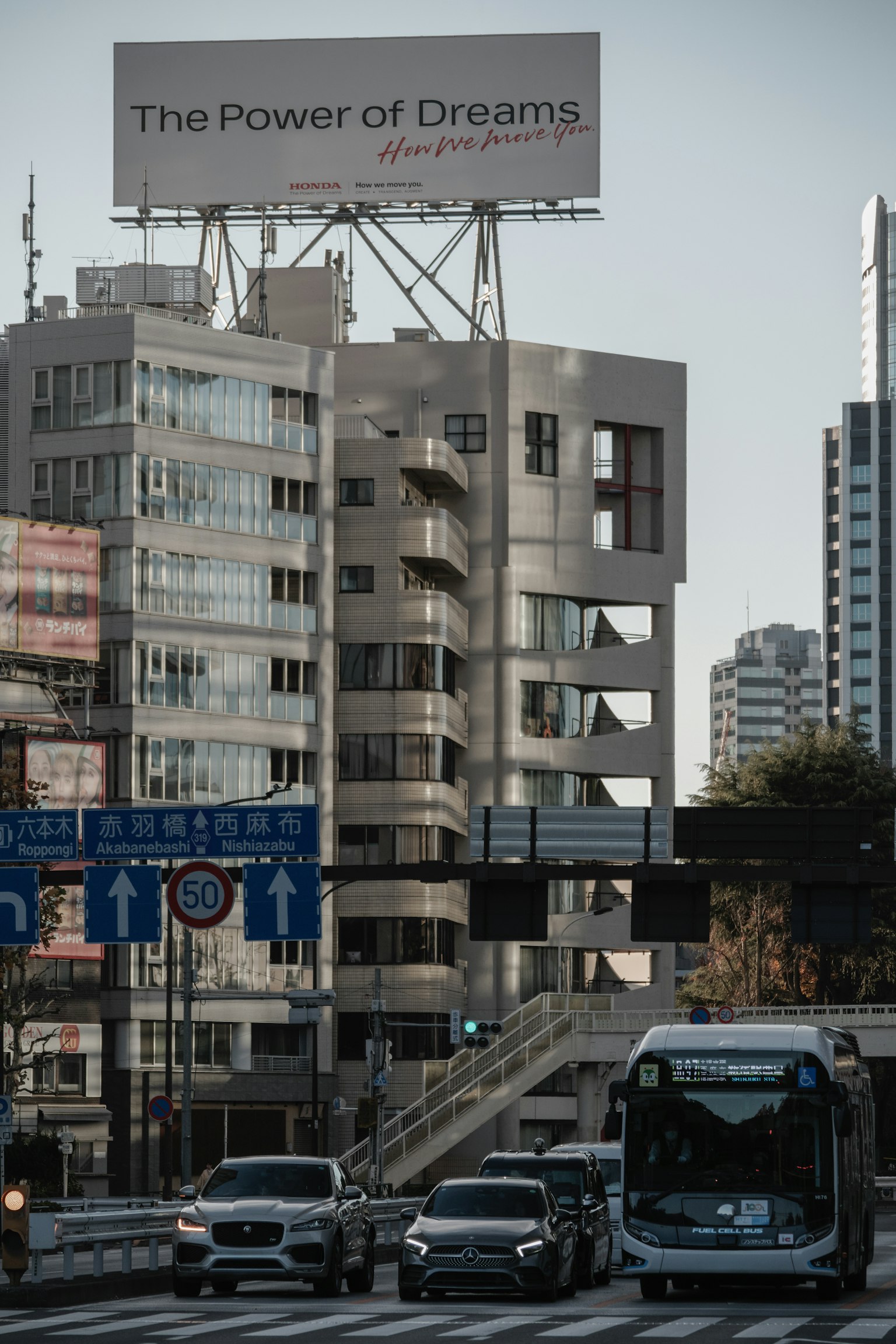 Urban landscape featuring a billboard that emphasizes the power of dreams