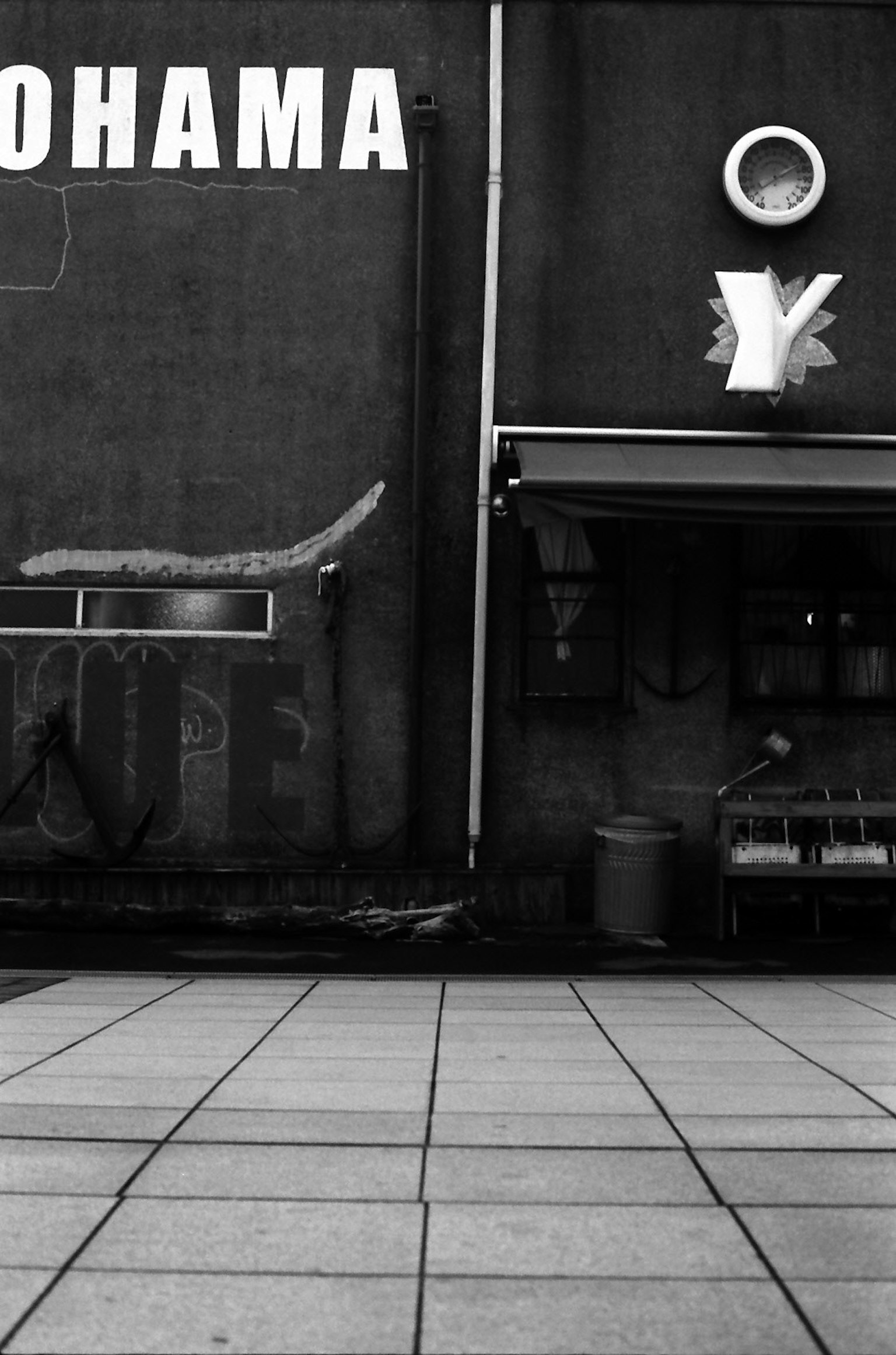 Large text reading Yokohama with a simple building facade