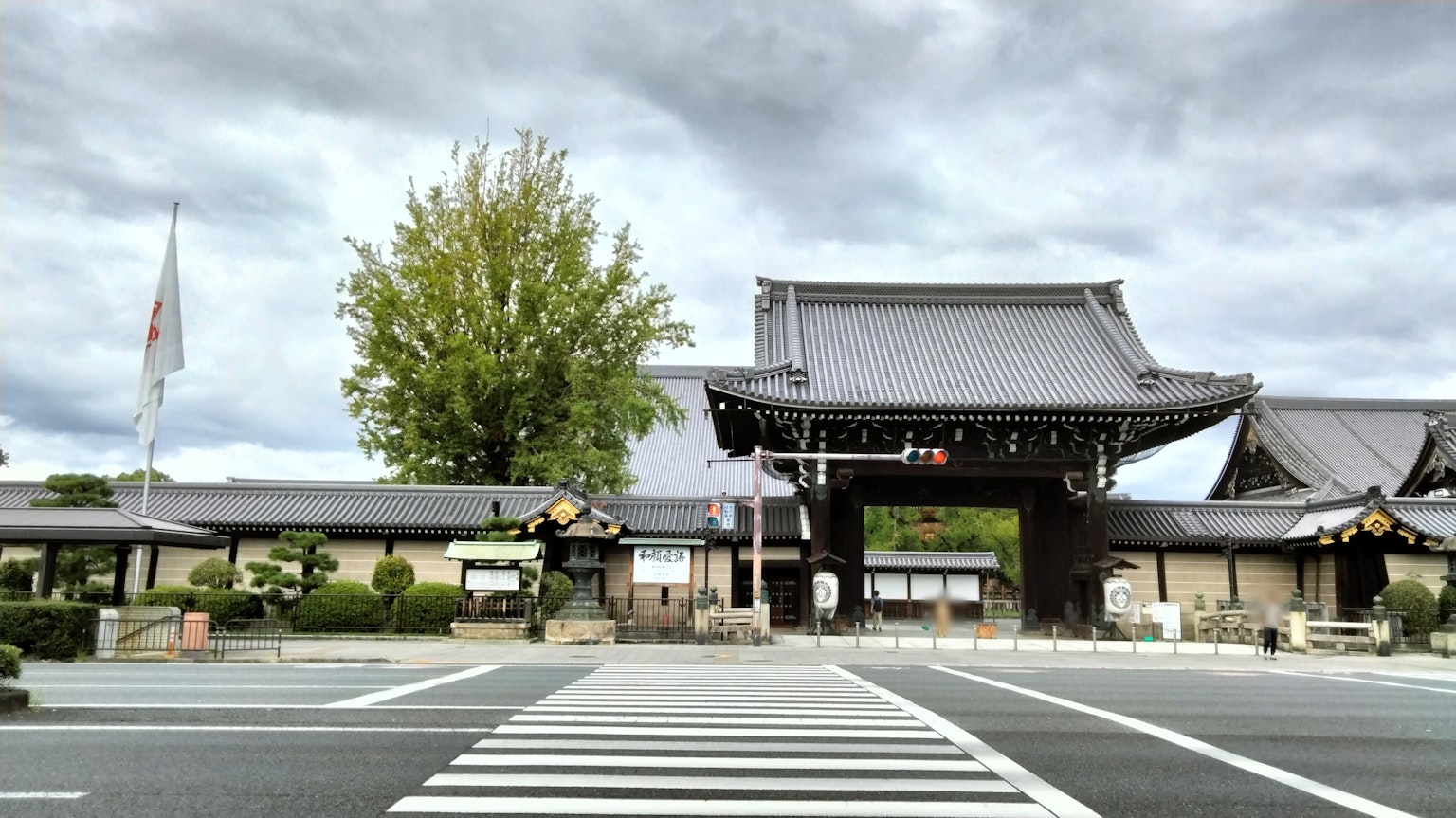 Traditional Japanese temple gate and buildings visible in the scenery