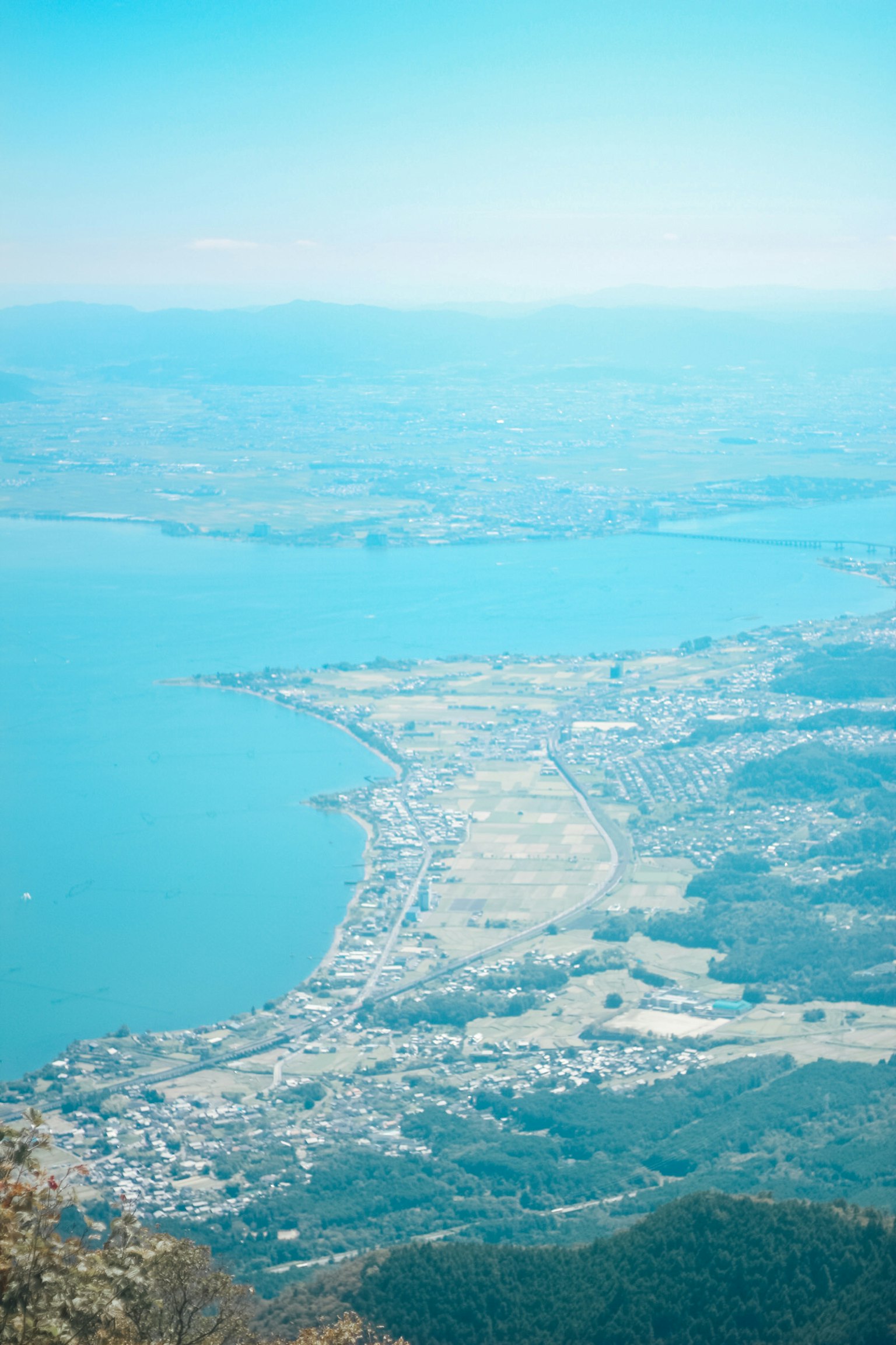 Aerial view of a coastal town with blue waters