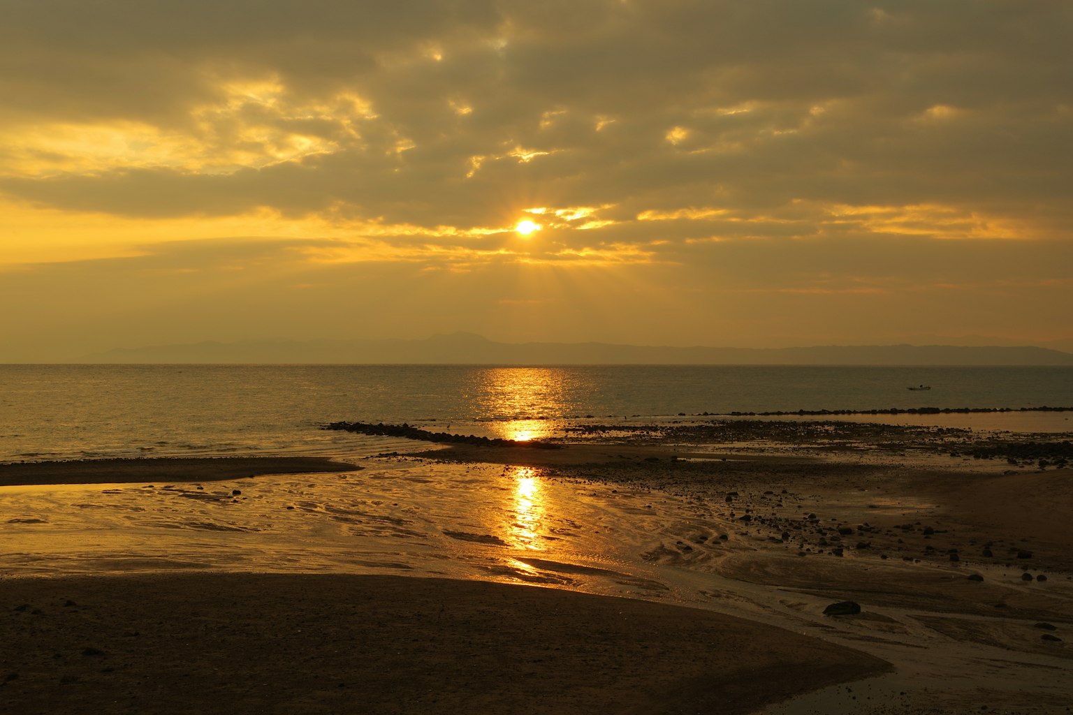 Beautiful sunset over the sea with orange reflections on the water