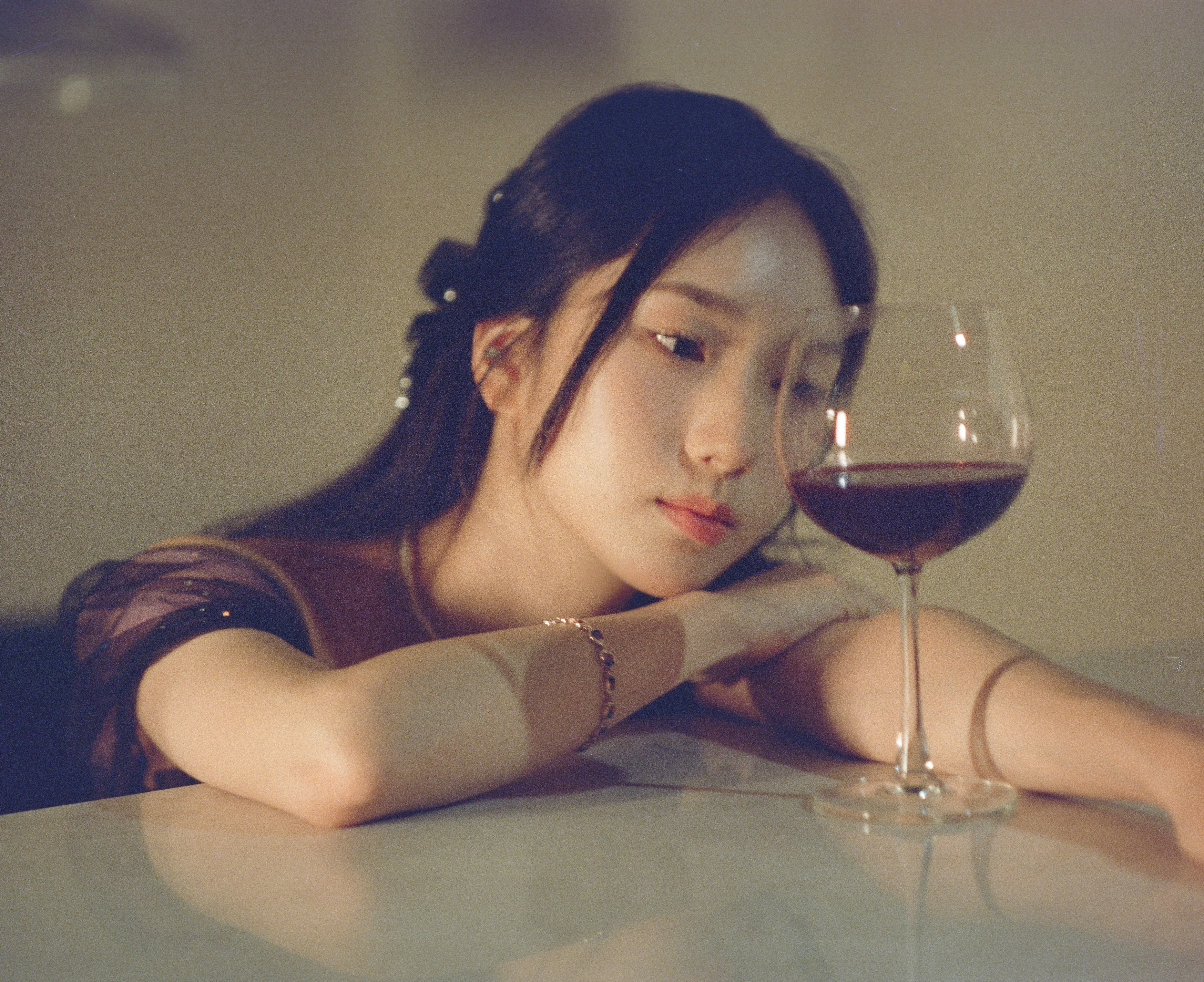 woman leaning with a wine glass