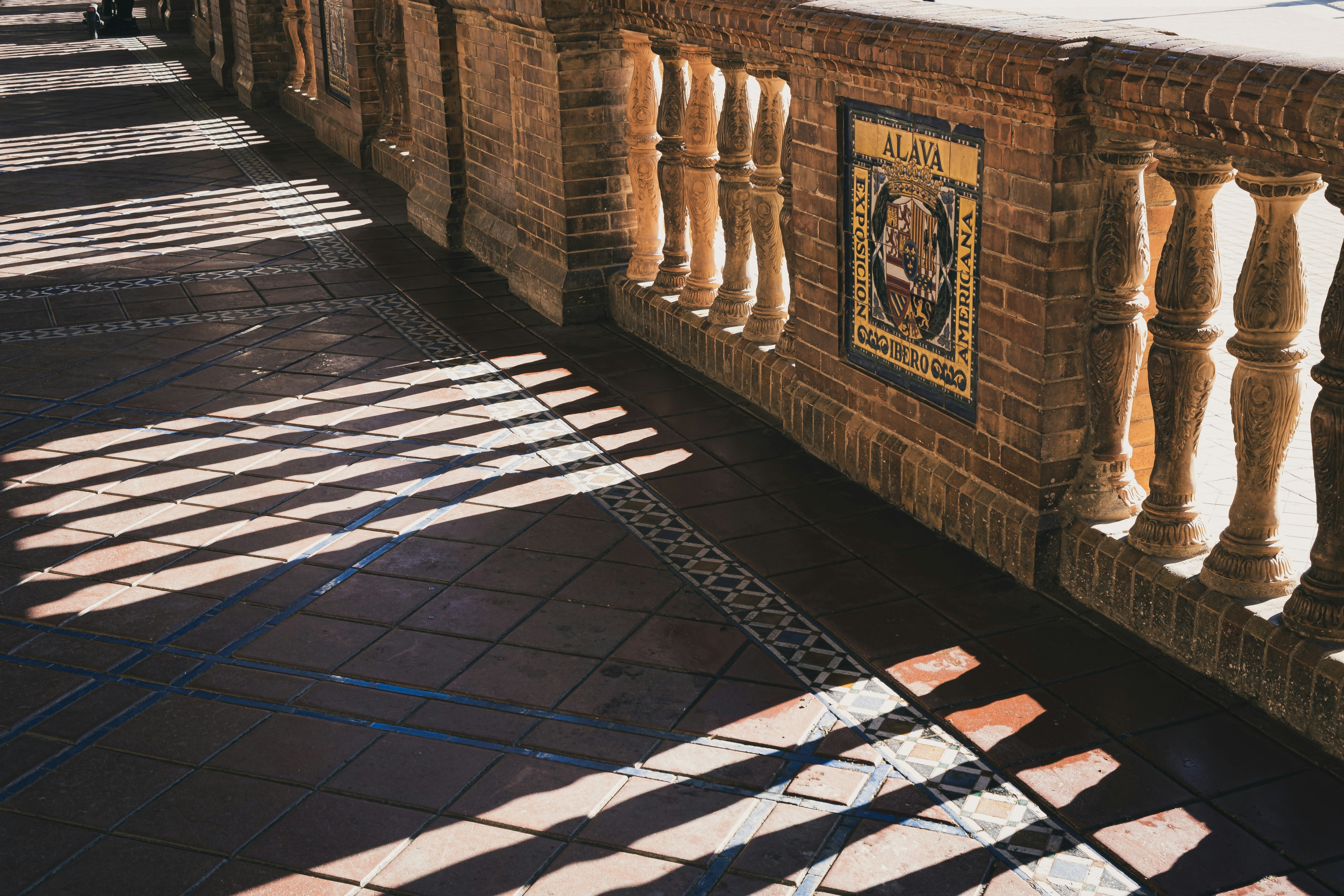 courtyard arcade with arches and geometric floor patterns