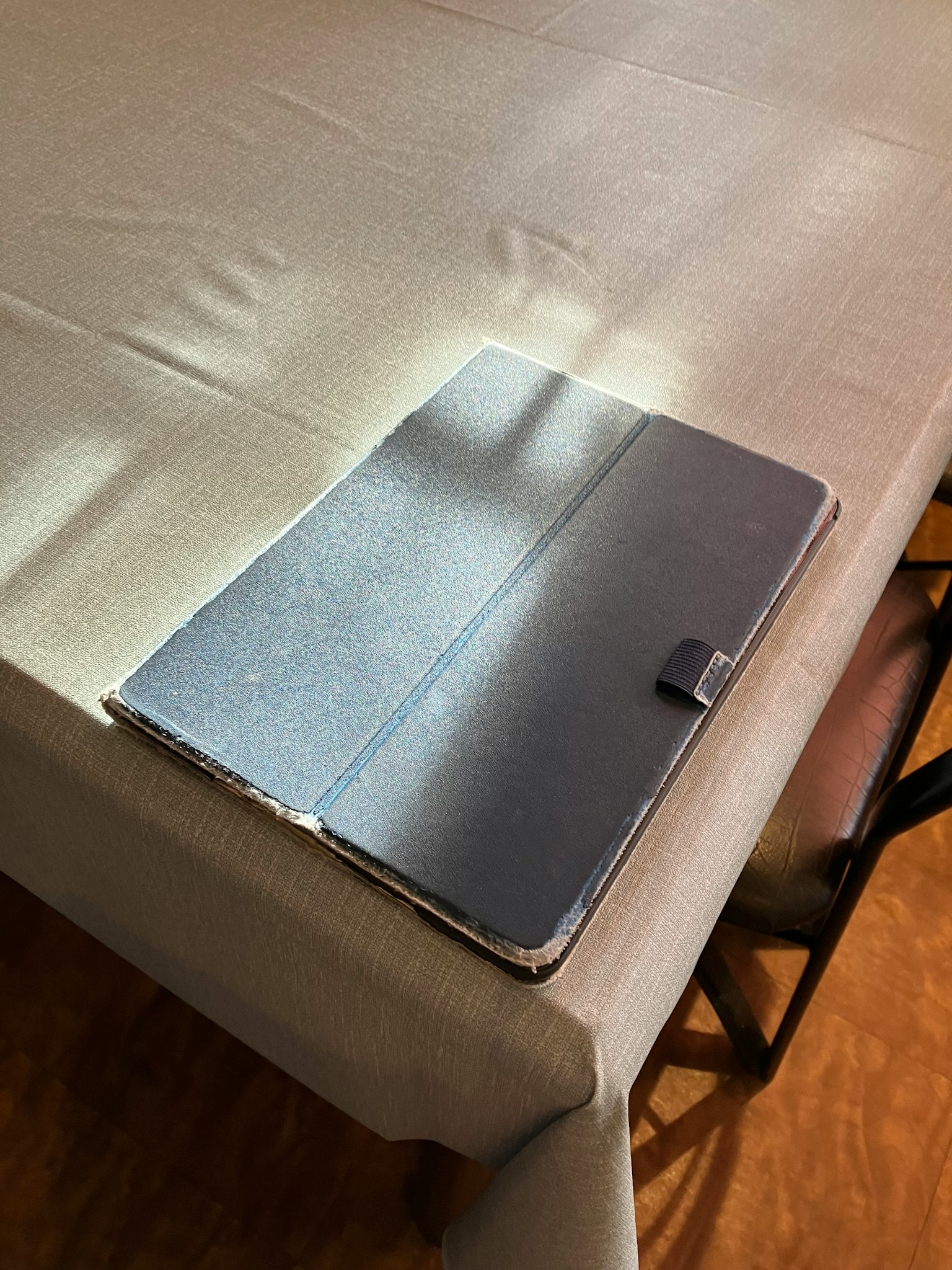 Black notebook cover placed on a table