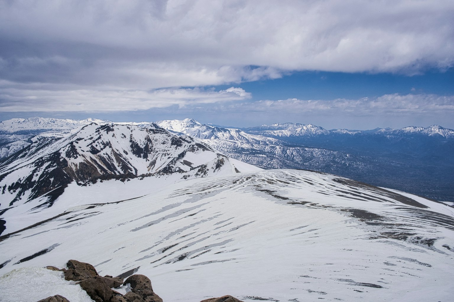 Beautiful landscape of snow-covered mountains with blue sky