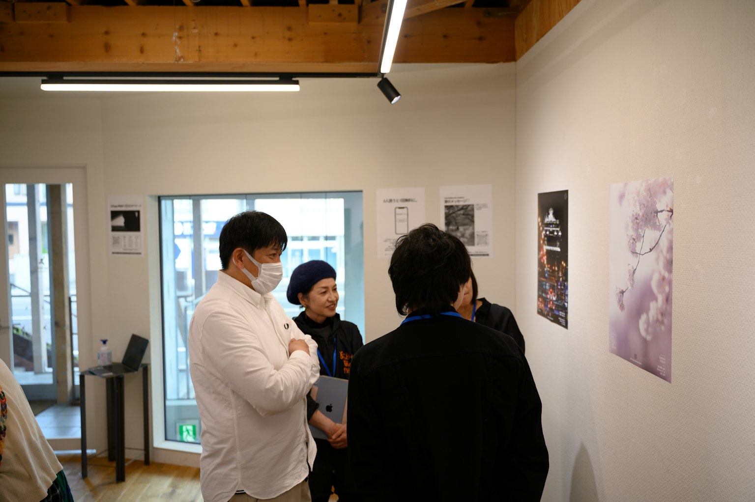 Group of people viewing artwork in an art gallery