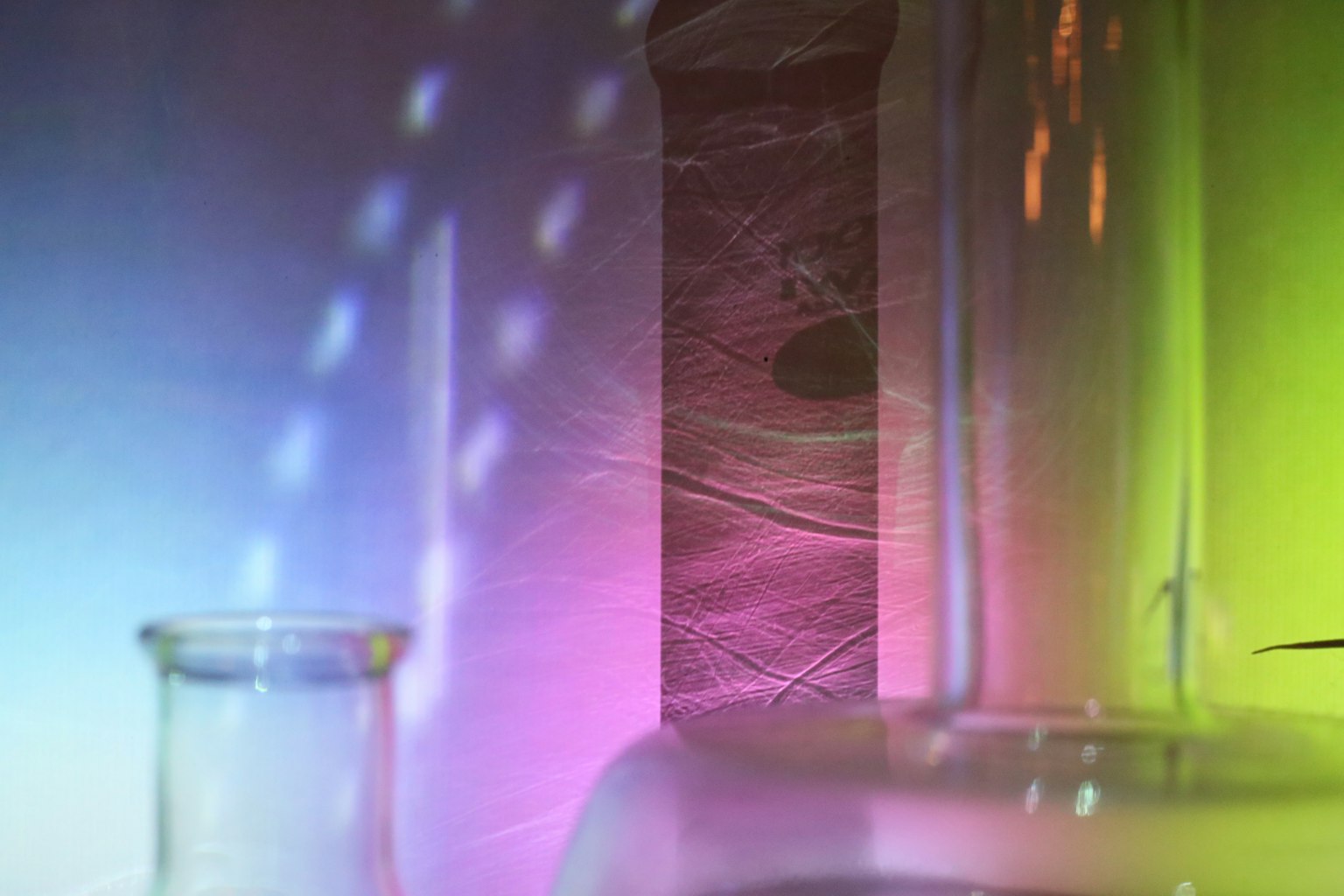 Colorful light reflections on laboratory glassware