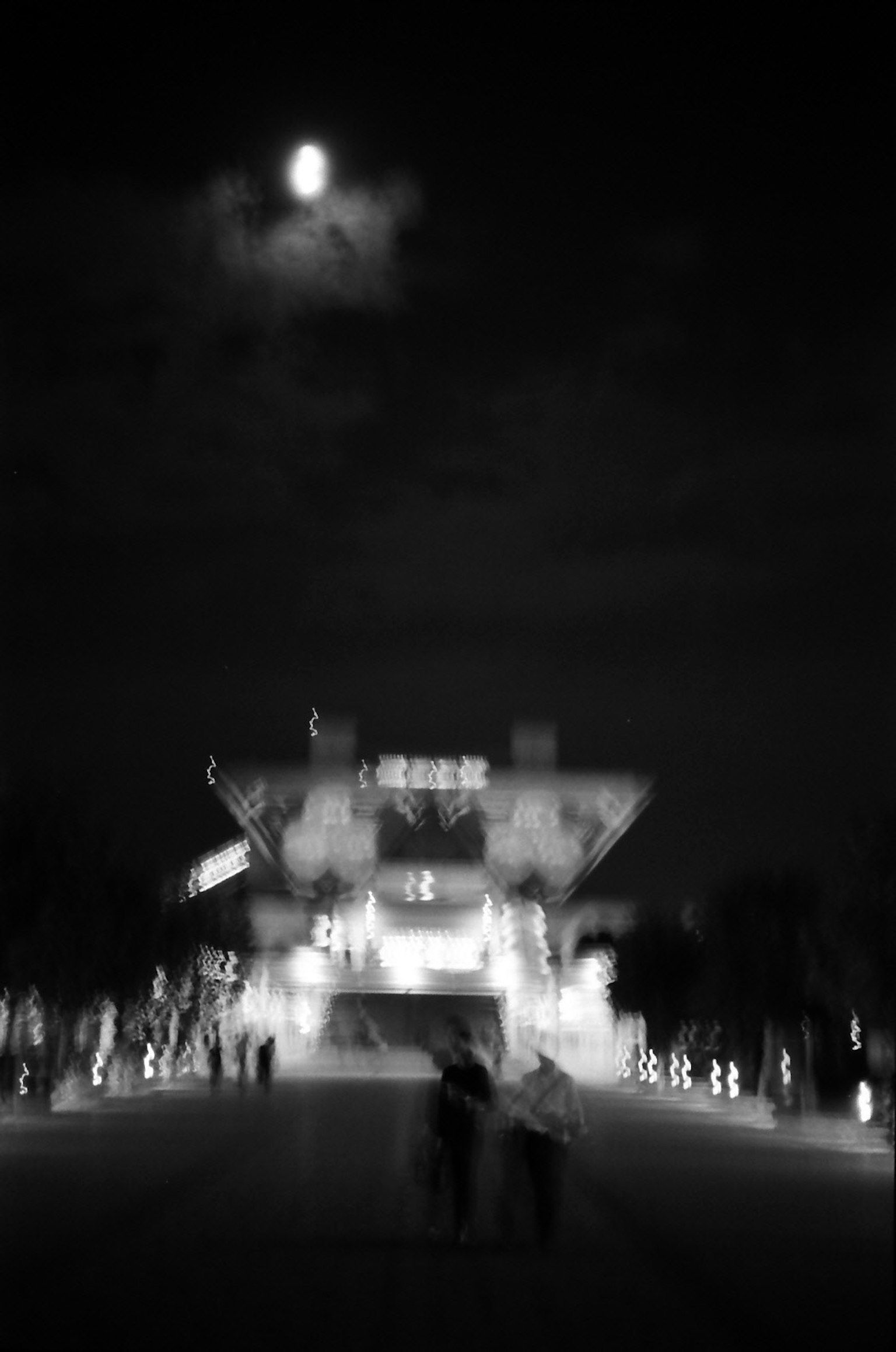 Blurred night scene with a visible moon